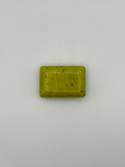 Polished healerite in the shape of a rectangular soap.