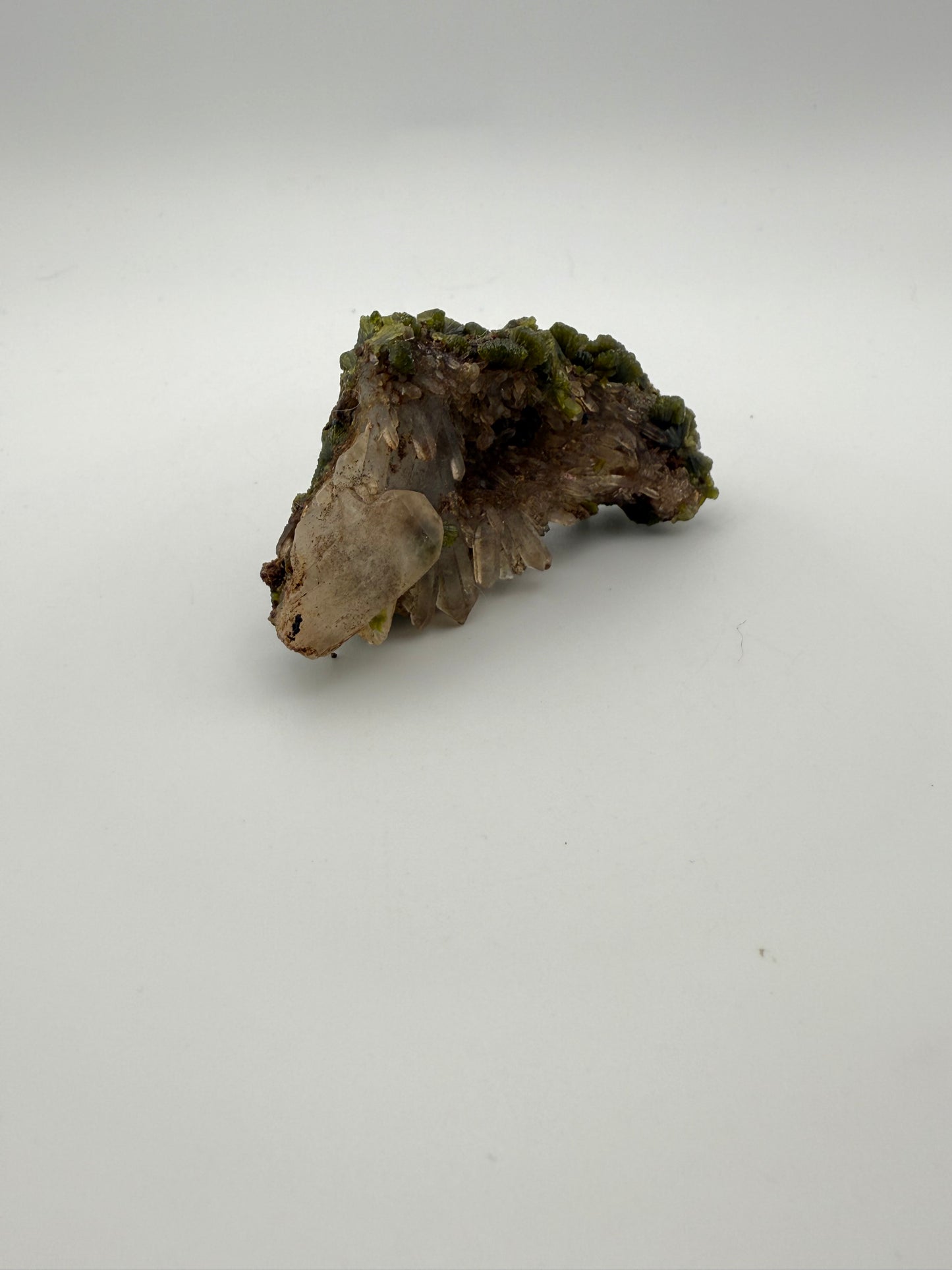 Epidote crystal cluster with good green color.