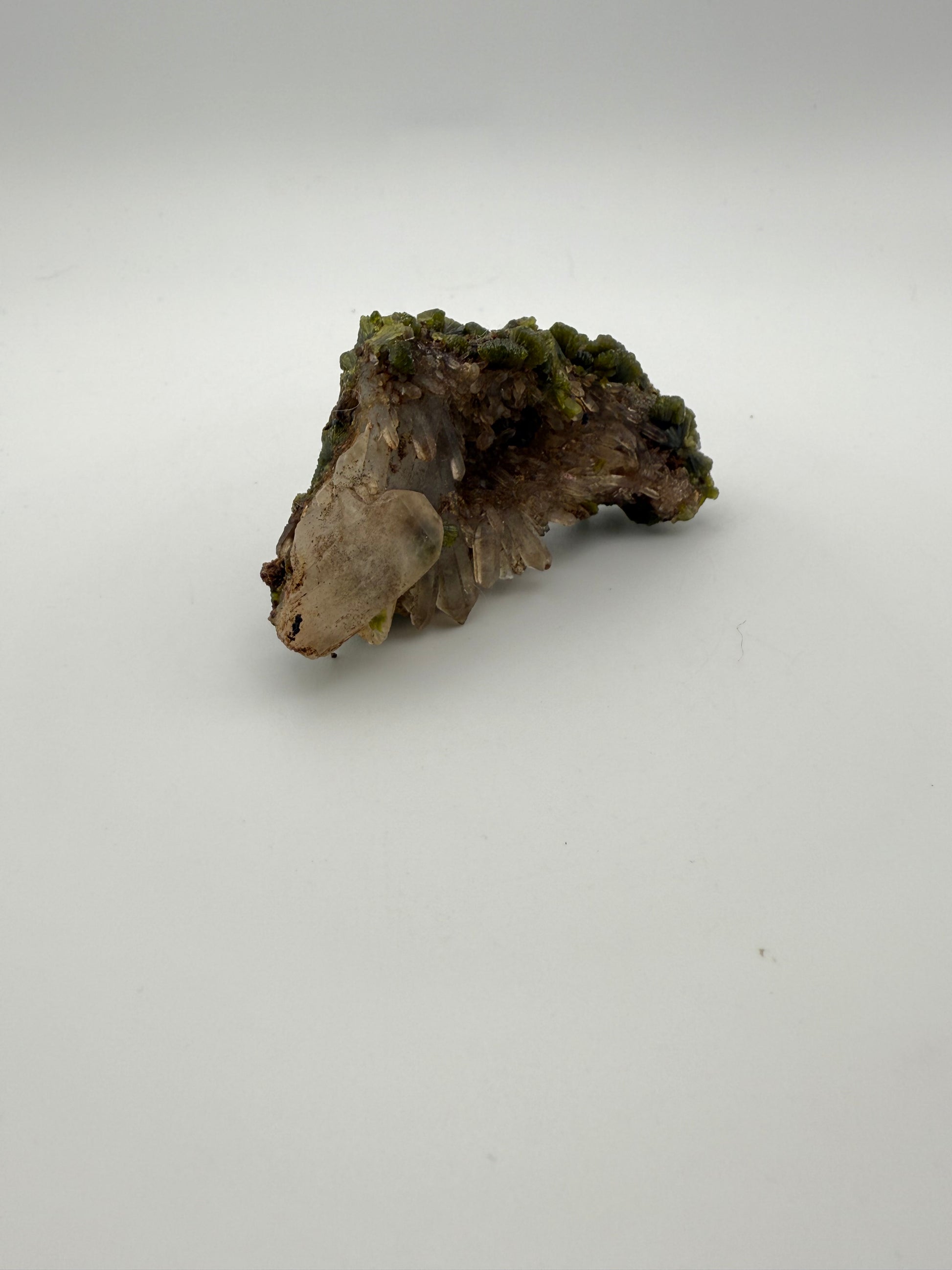 Epidote crystal cluster with good green color.