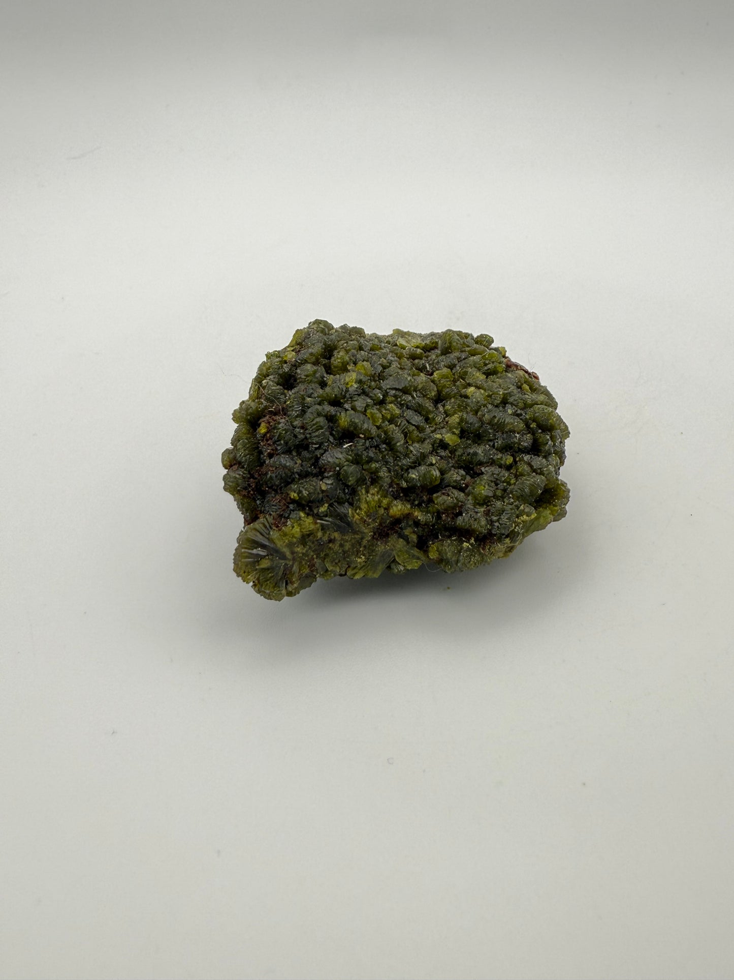 Epidote crystal cluster with good green color.
