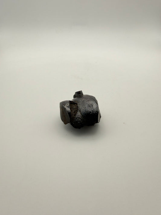 Small raw hematite specimen.