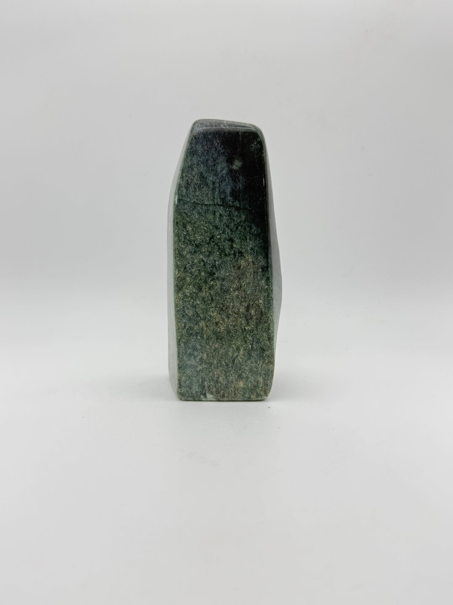 Polished green jade free form.