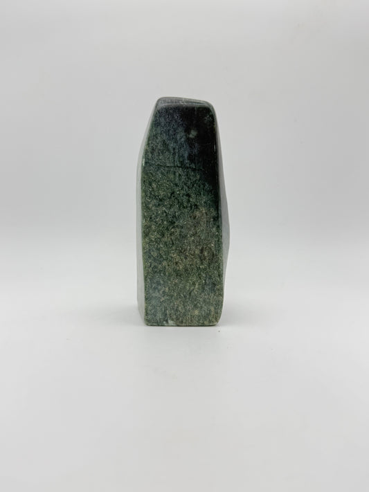 Polished green jade free form.