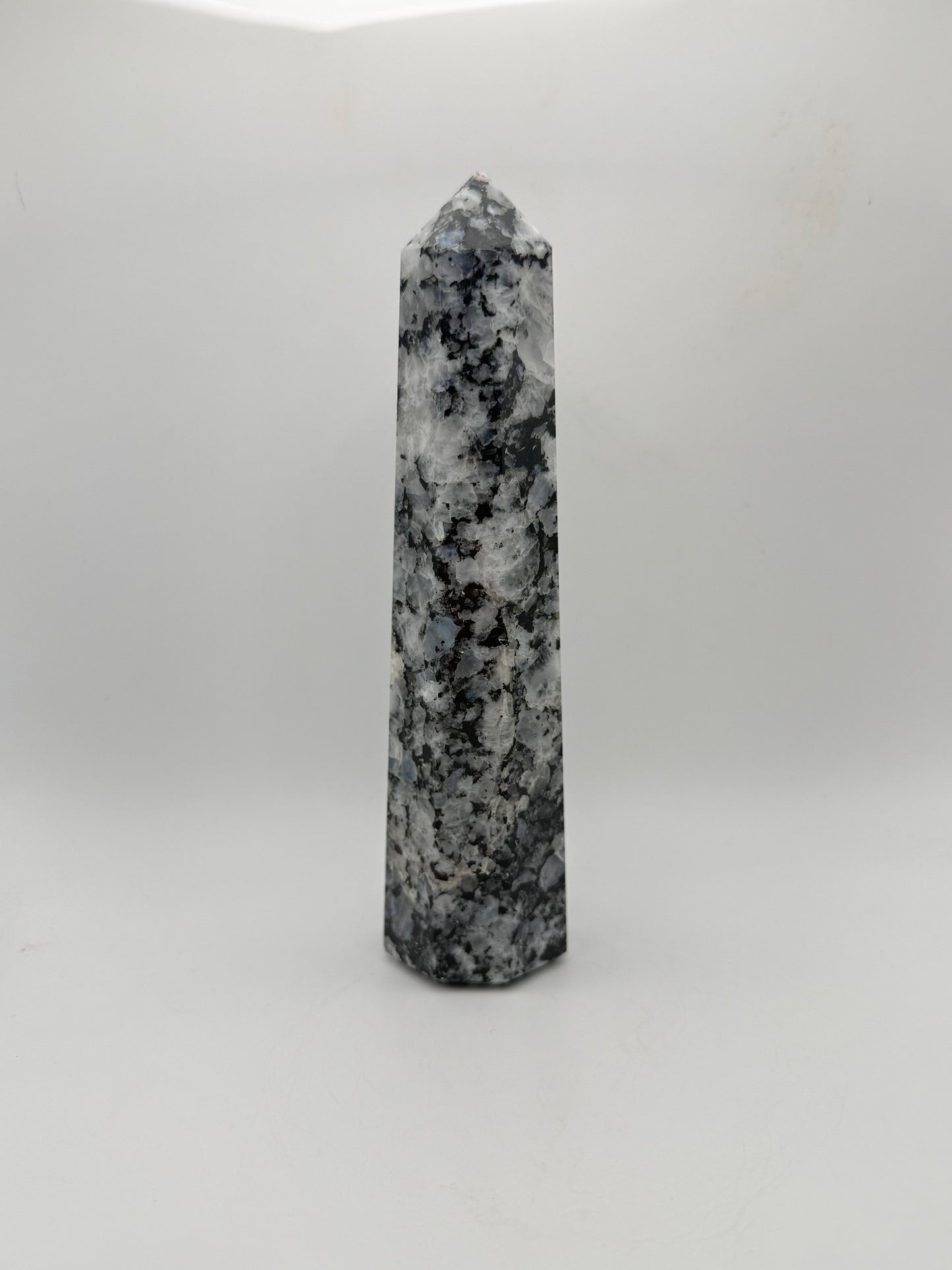 Rainbow moonstone polished tower with nice flashes of blue.