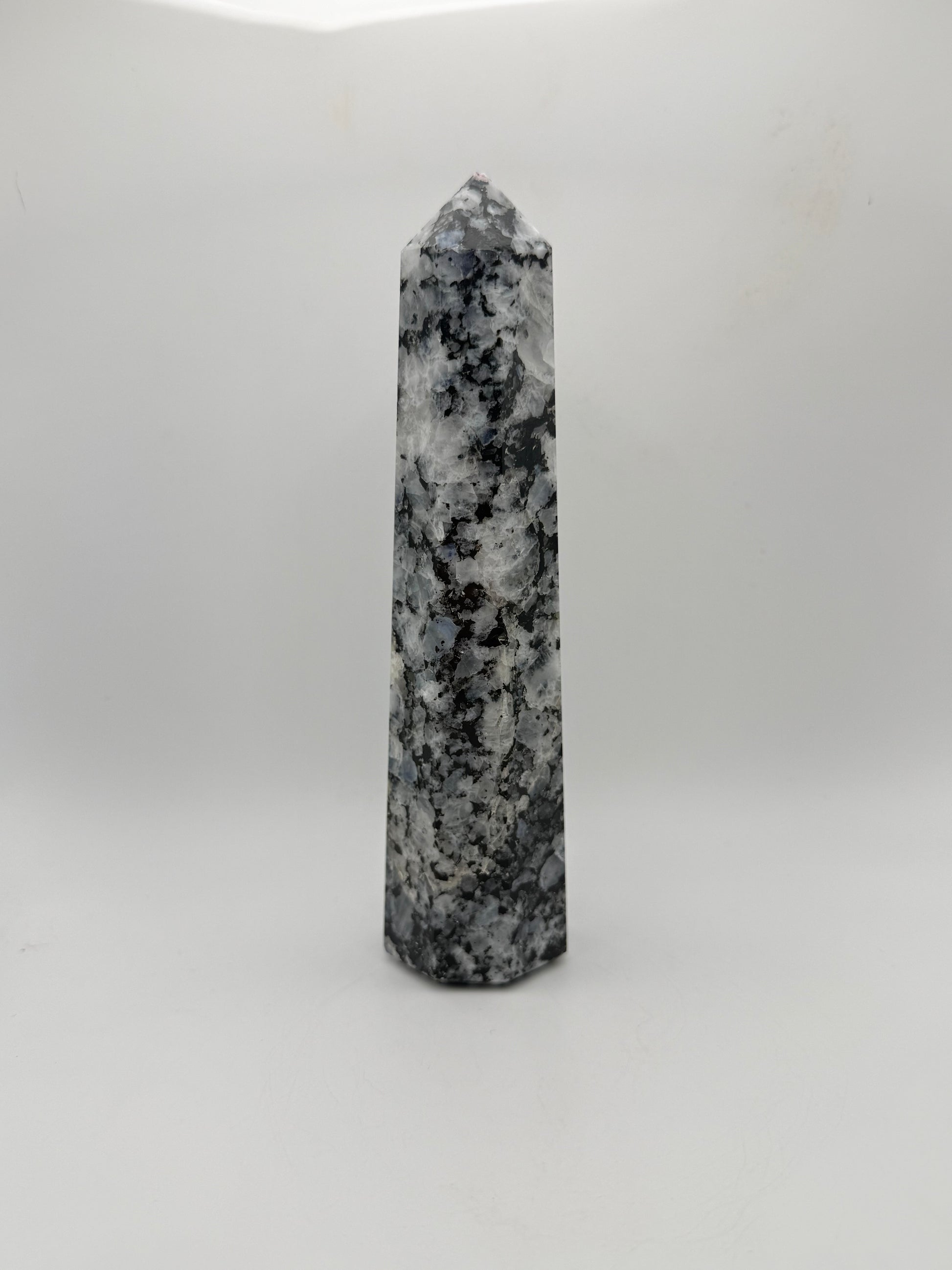 Rainbow moonstone polished tower with nice flashes of blue.