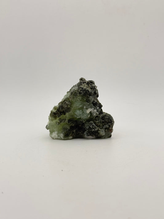 Raw Prehnite specimen with amazing green color.