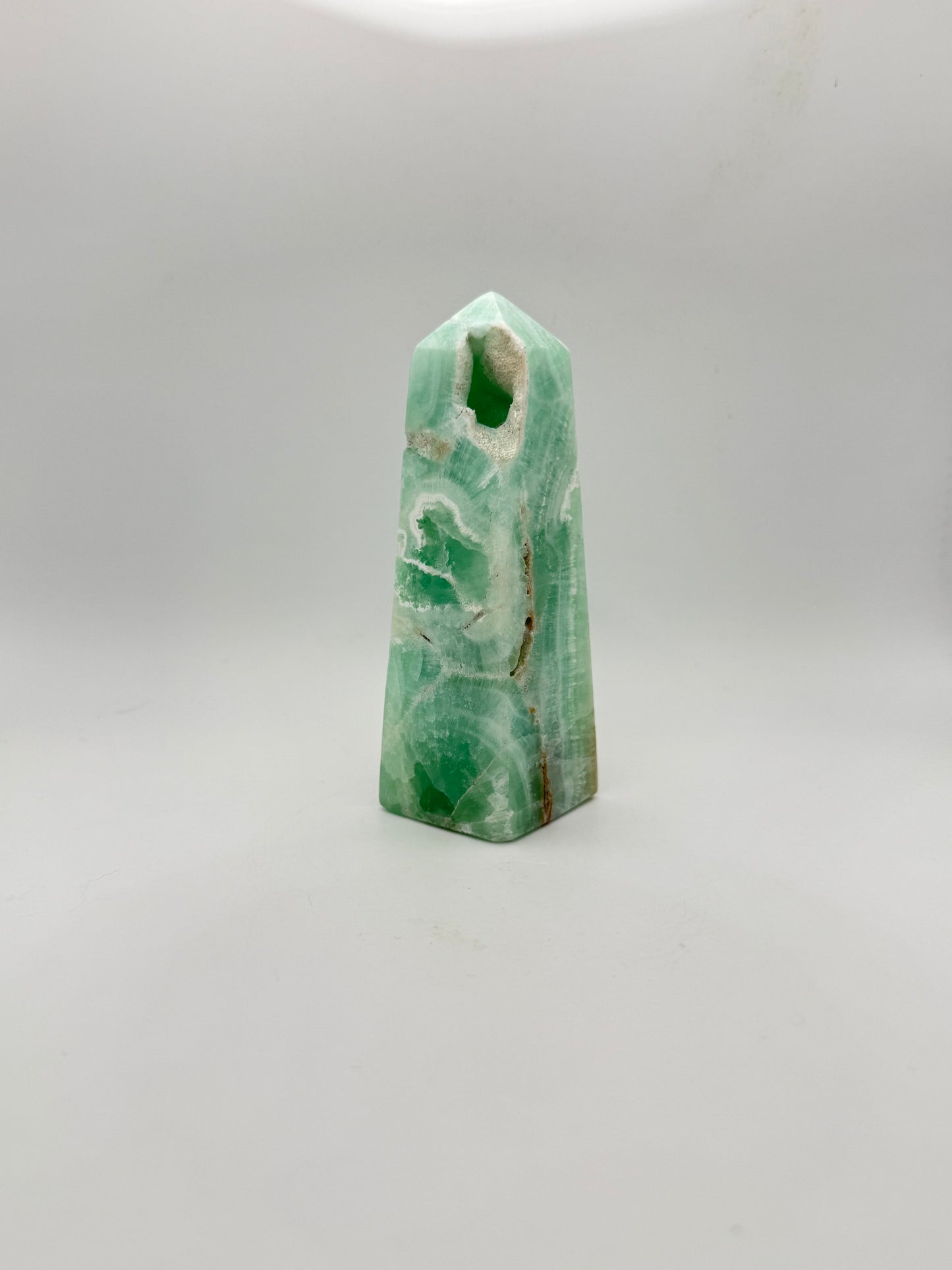 Caribbean Calcite polished four sided tower. This is 4.75 inches tall.