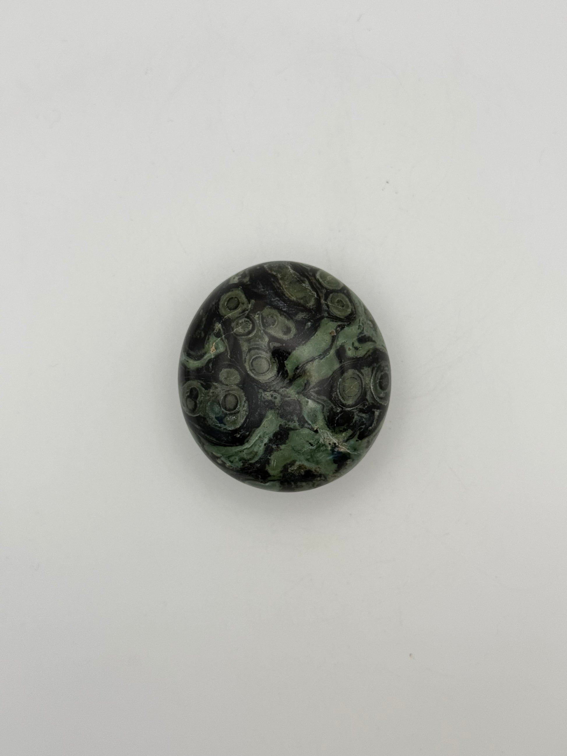Polished kambaba jasper palm stone.