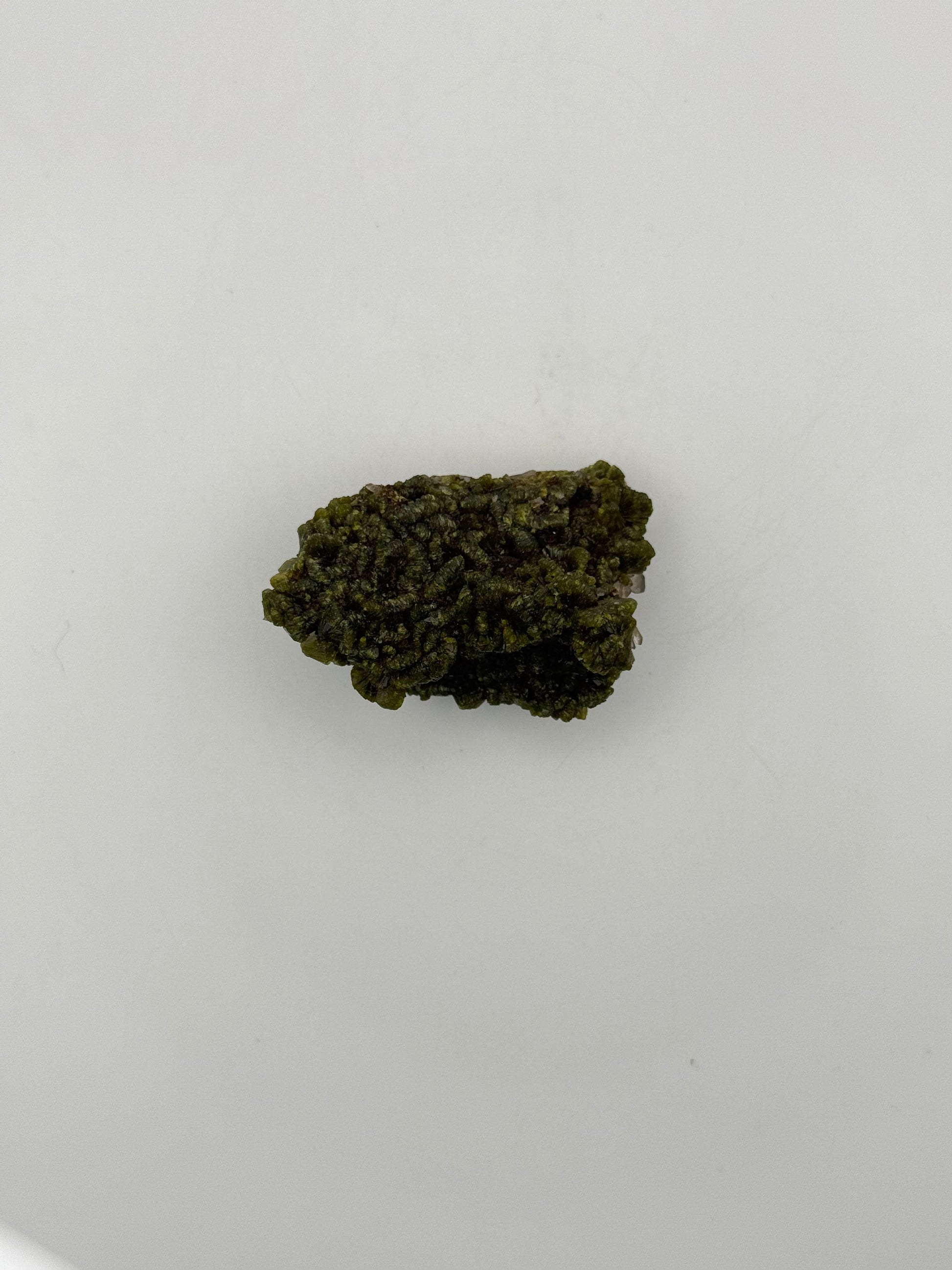Epidote crystal cluster with good green color.