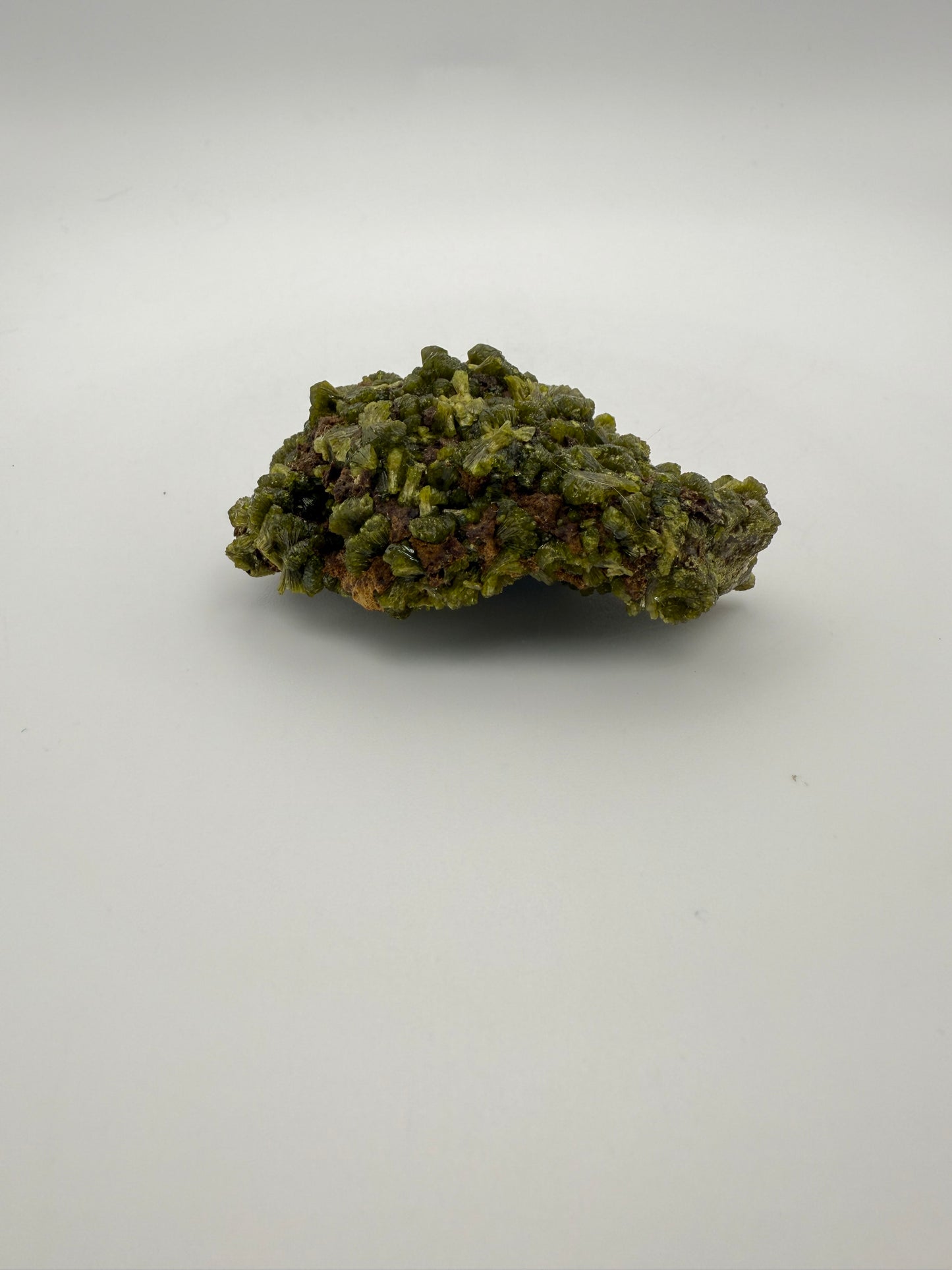 Epidote crystal cluster with good green color.