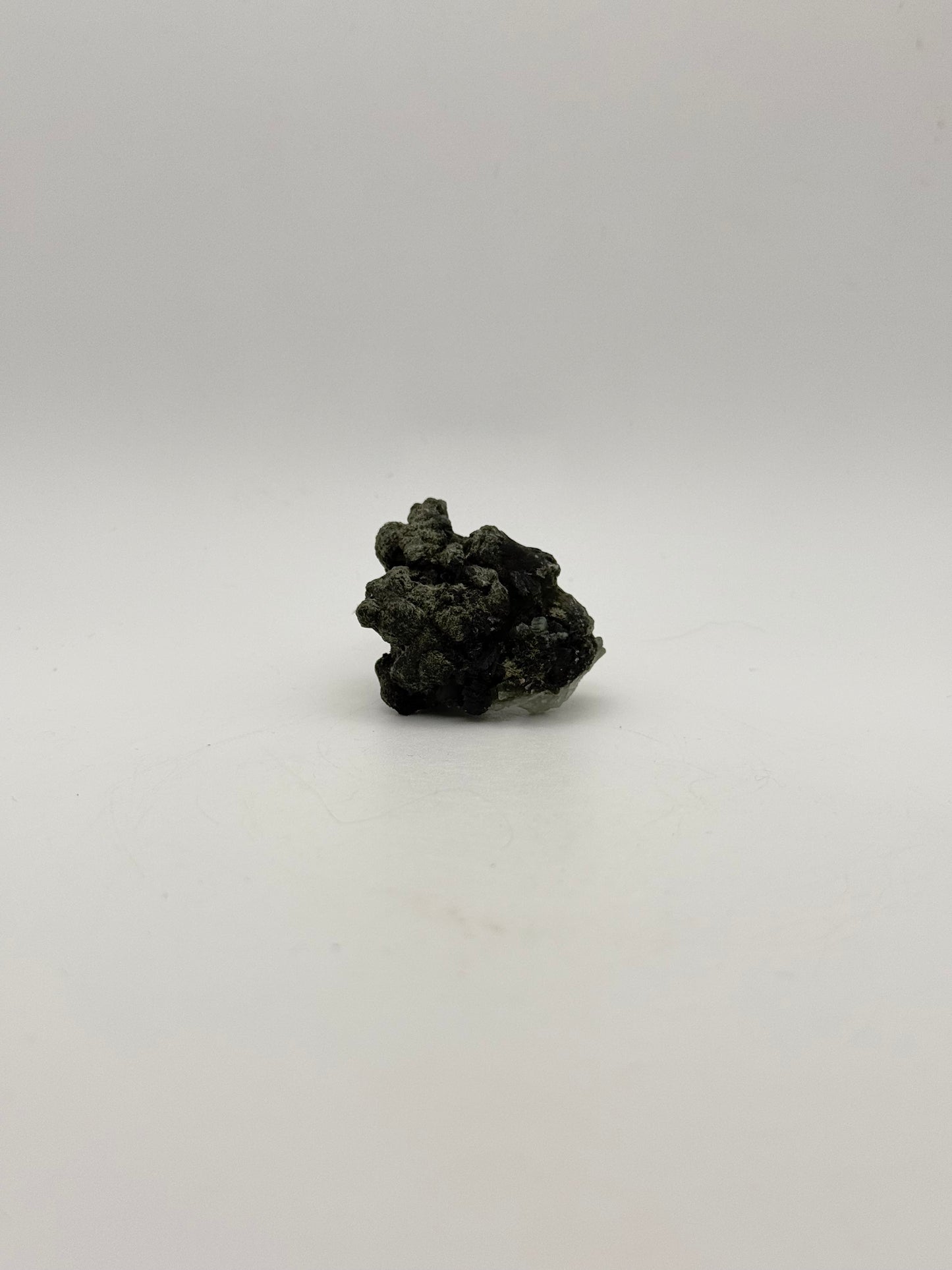 Raw prehnite specimen with amazing green color.