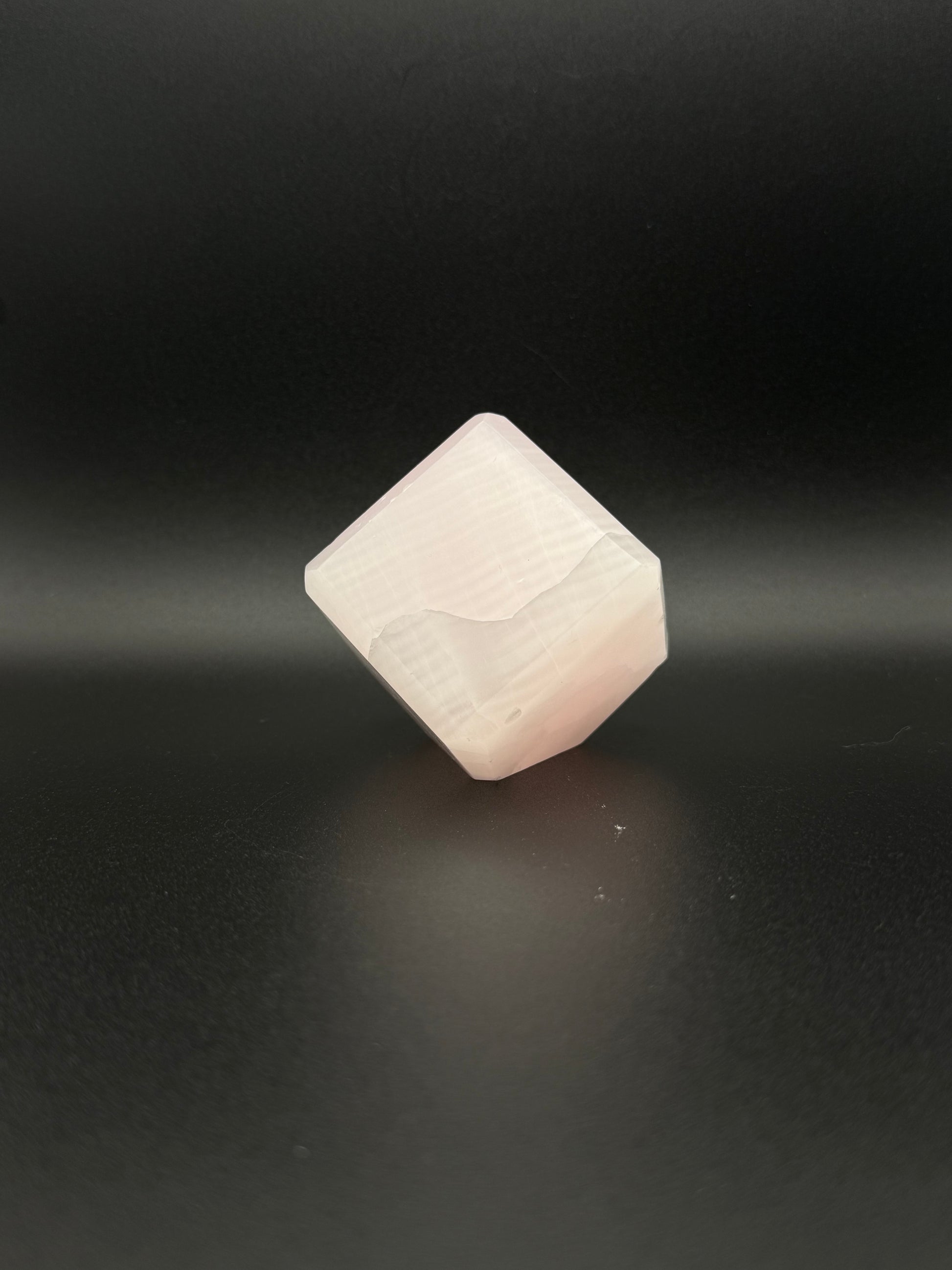 Polished Pink Calcite cut cube. Pink calcite is uv reactive.