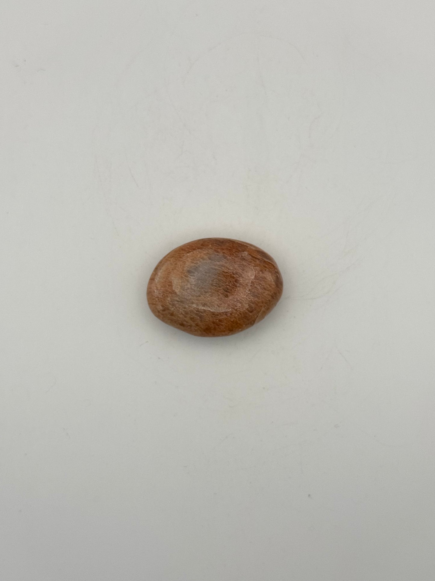 Polished Peach moonstone palm stone.