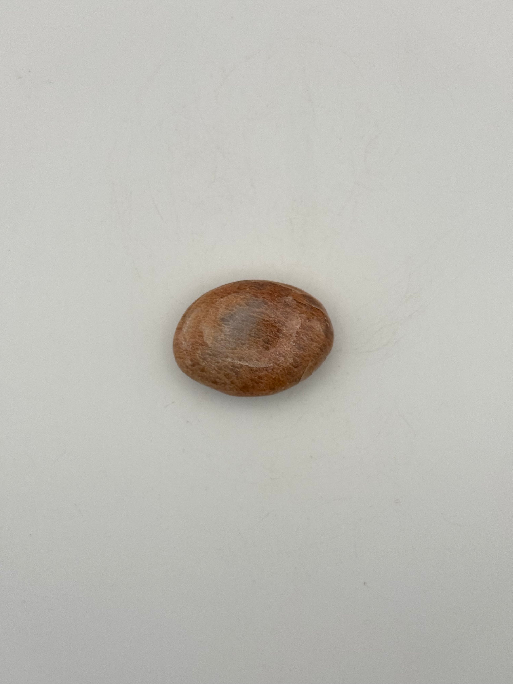 Polished Peach moonstone palm stone.