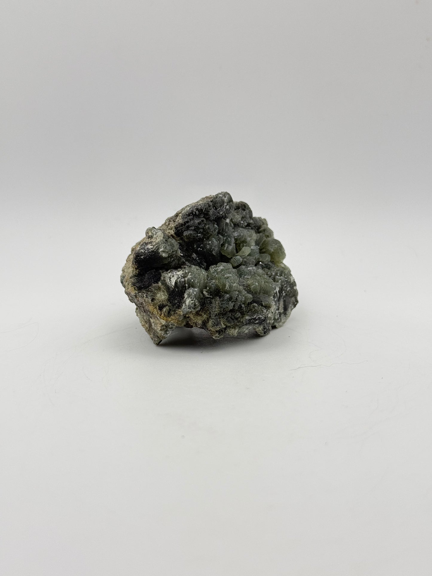 Raw prehnite specimen with amazing green color.