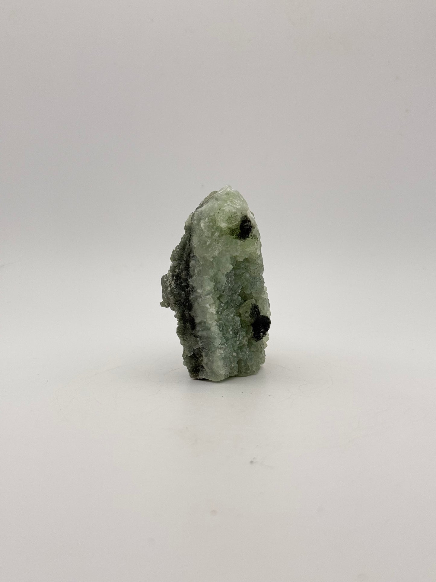 Raw Prehnite specimen with amazing green color.