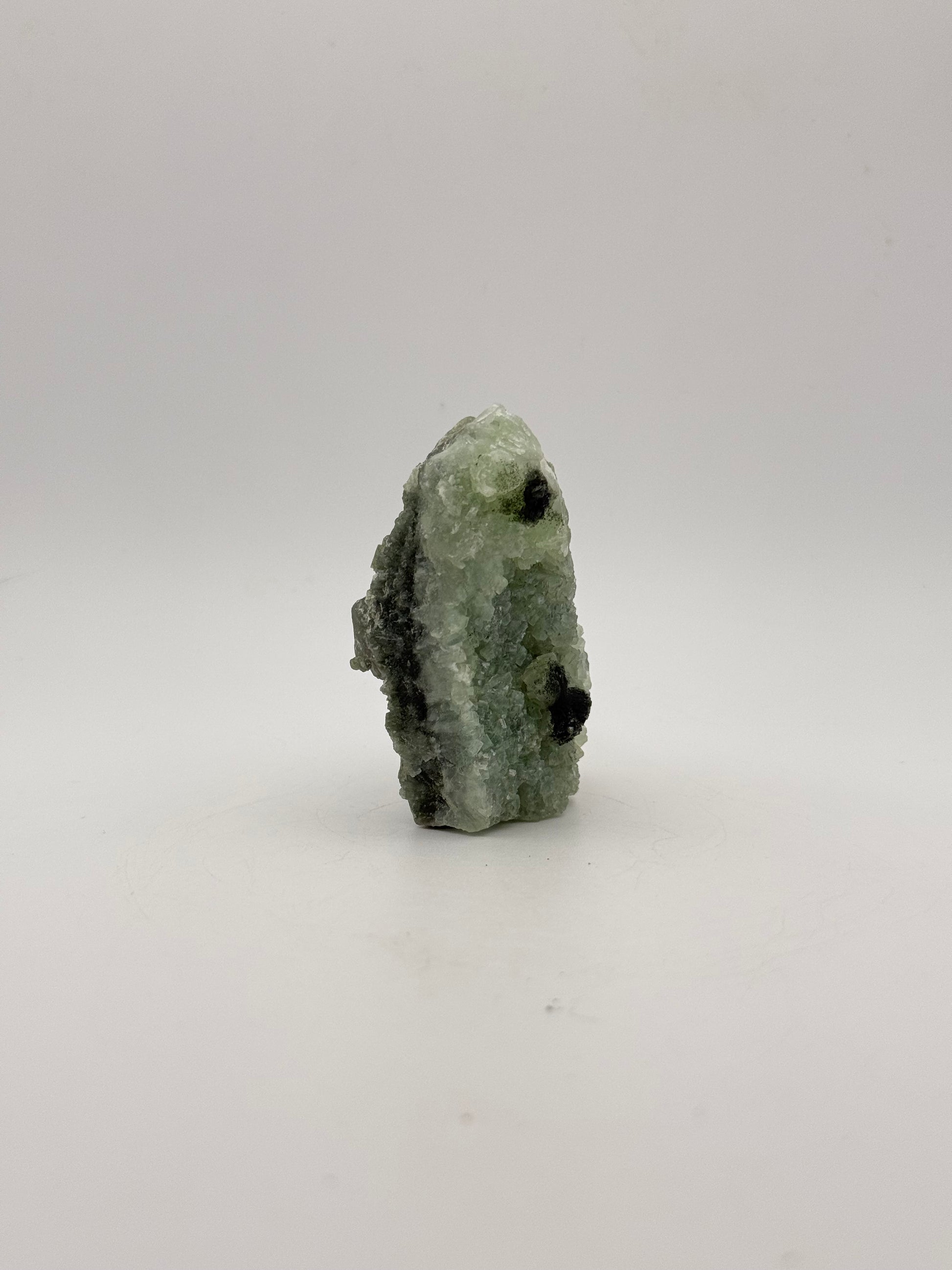 Raw Prehnite specimen with amazing green color.