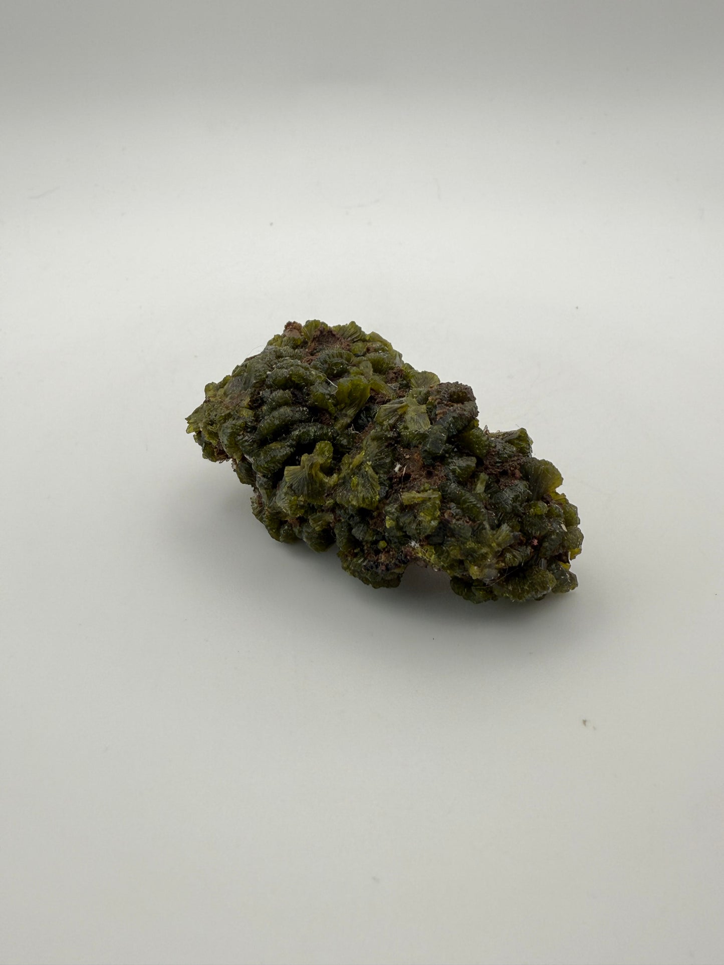 Epidote crystal cluster with good green color.