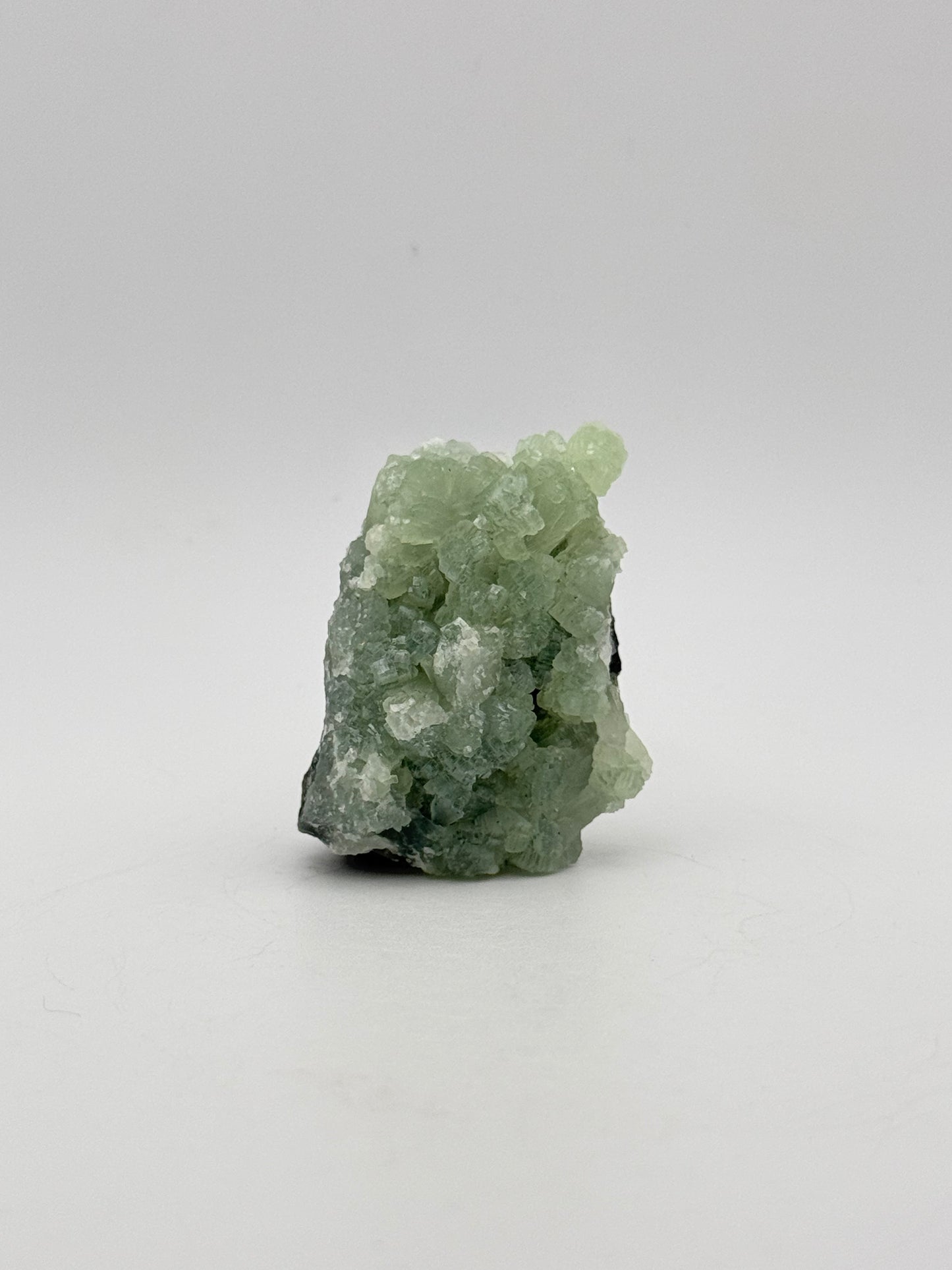 Raw Prehnite specimen with amazing green color.