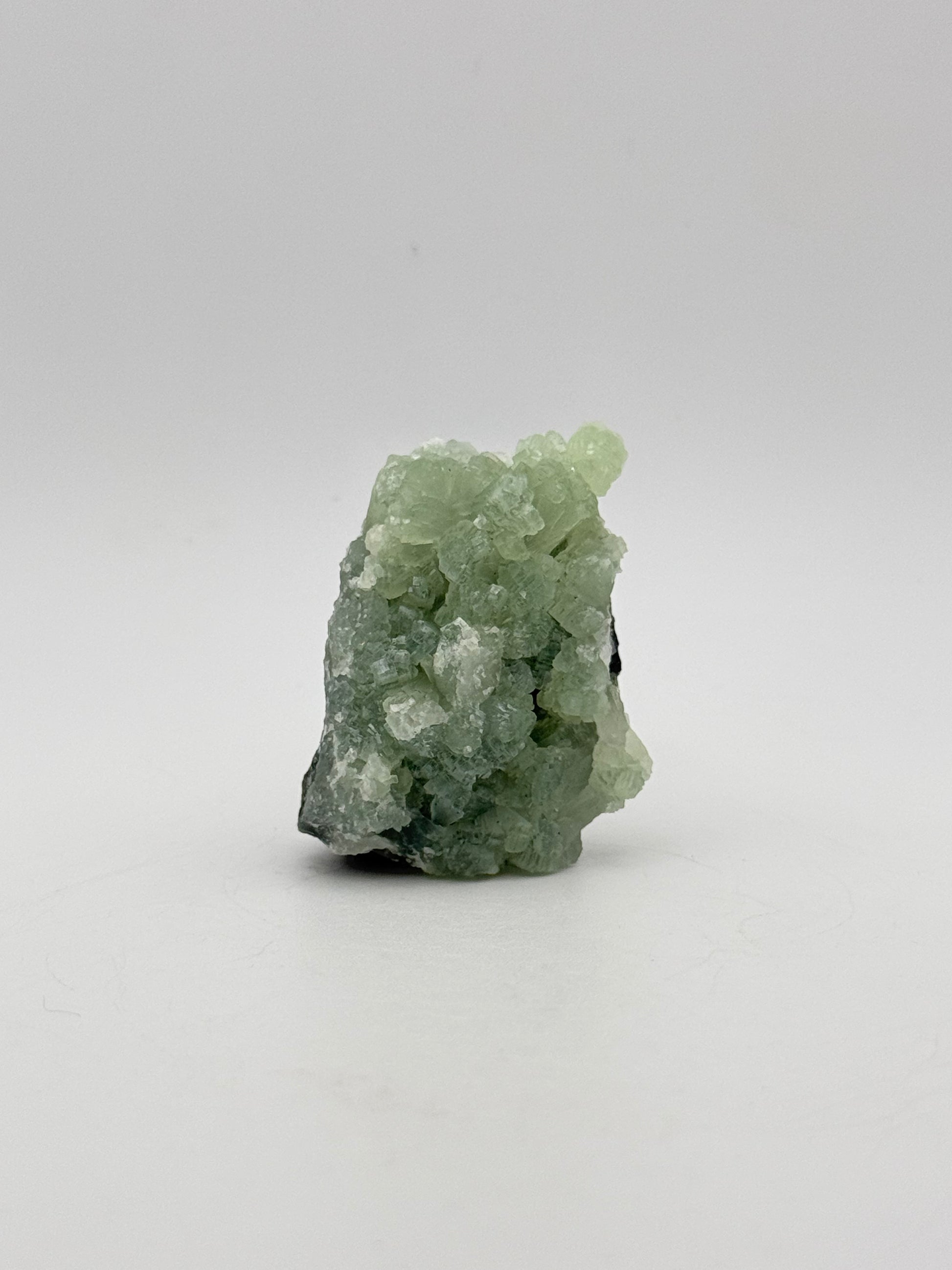 Raw Prehnite specimen with amazing green color.