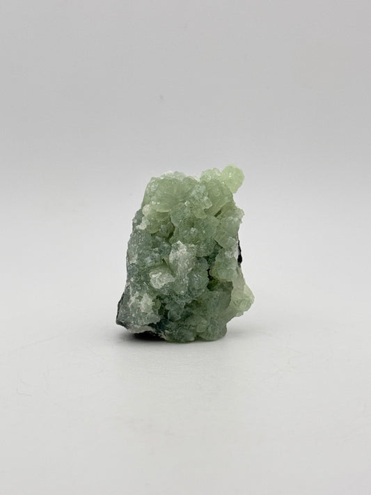 Raw Prehnite specimen with amazing green color.
