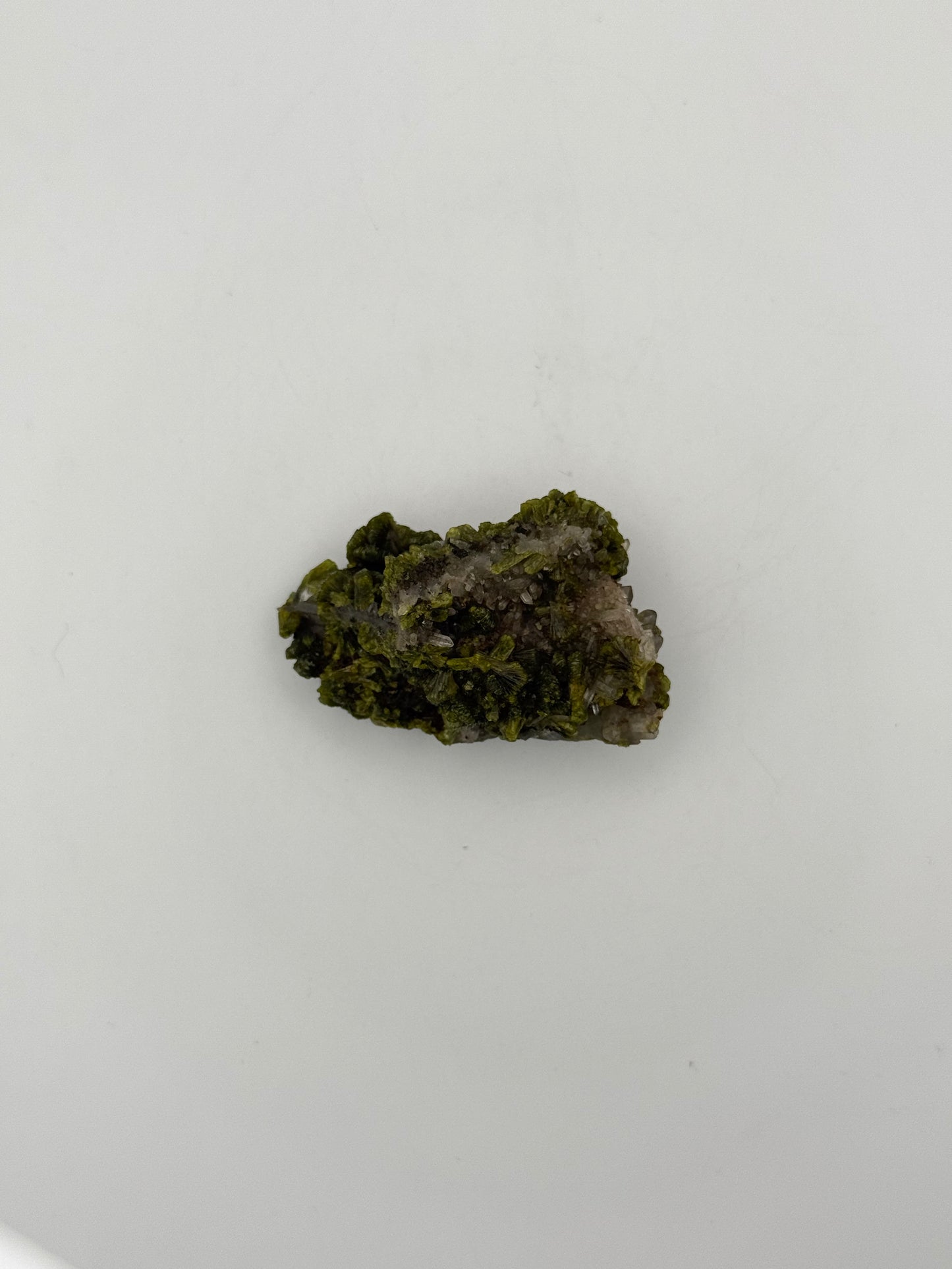 Epidote crystal cluster with good green color.