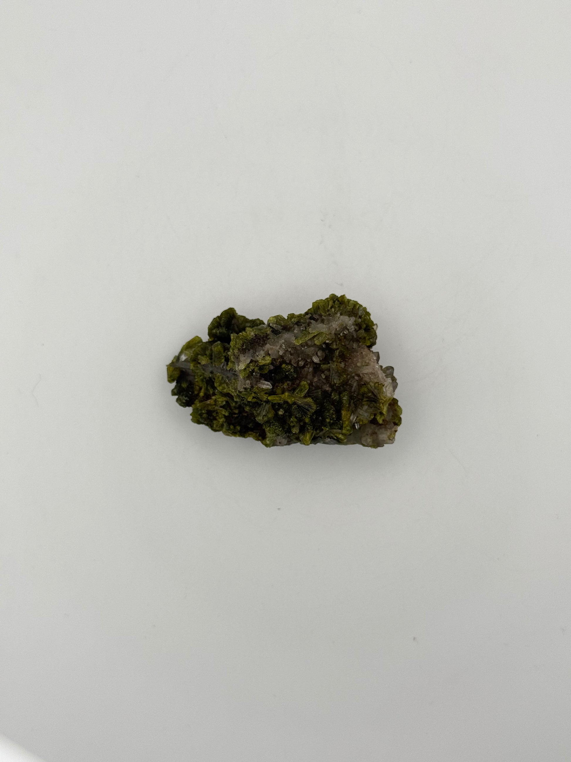 Epidote crystal cluster with good green color.
