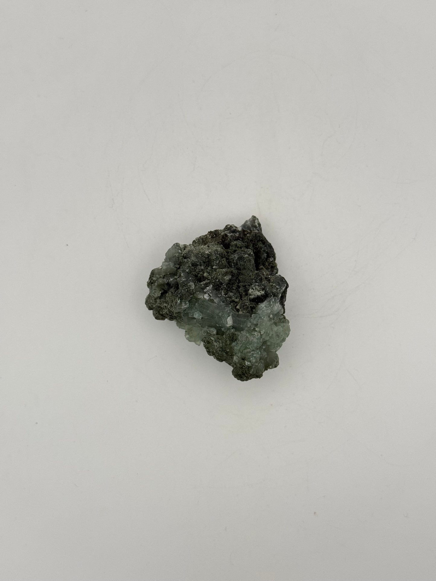 Raw Prehnite specimen with amazing green color.