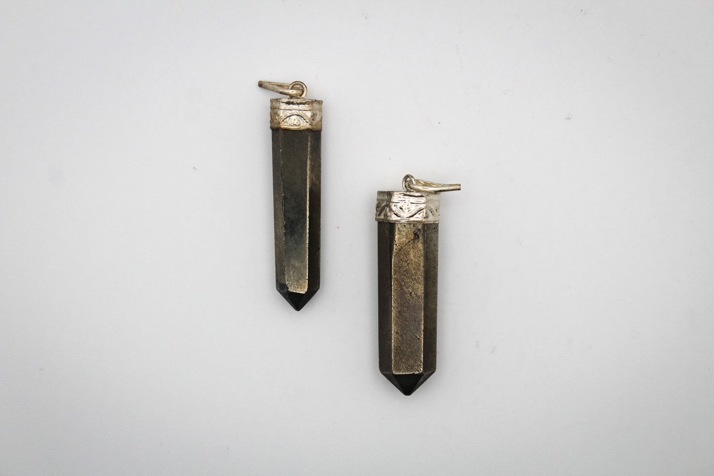 Pyrite pencil pendants.