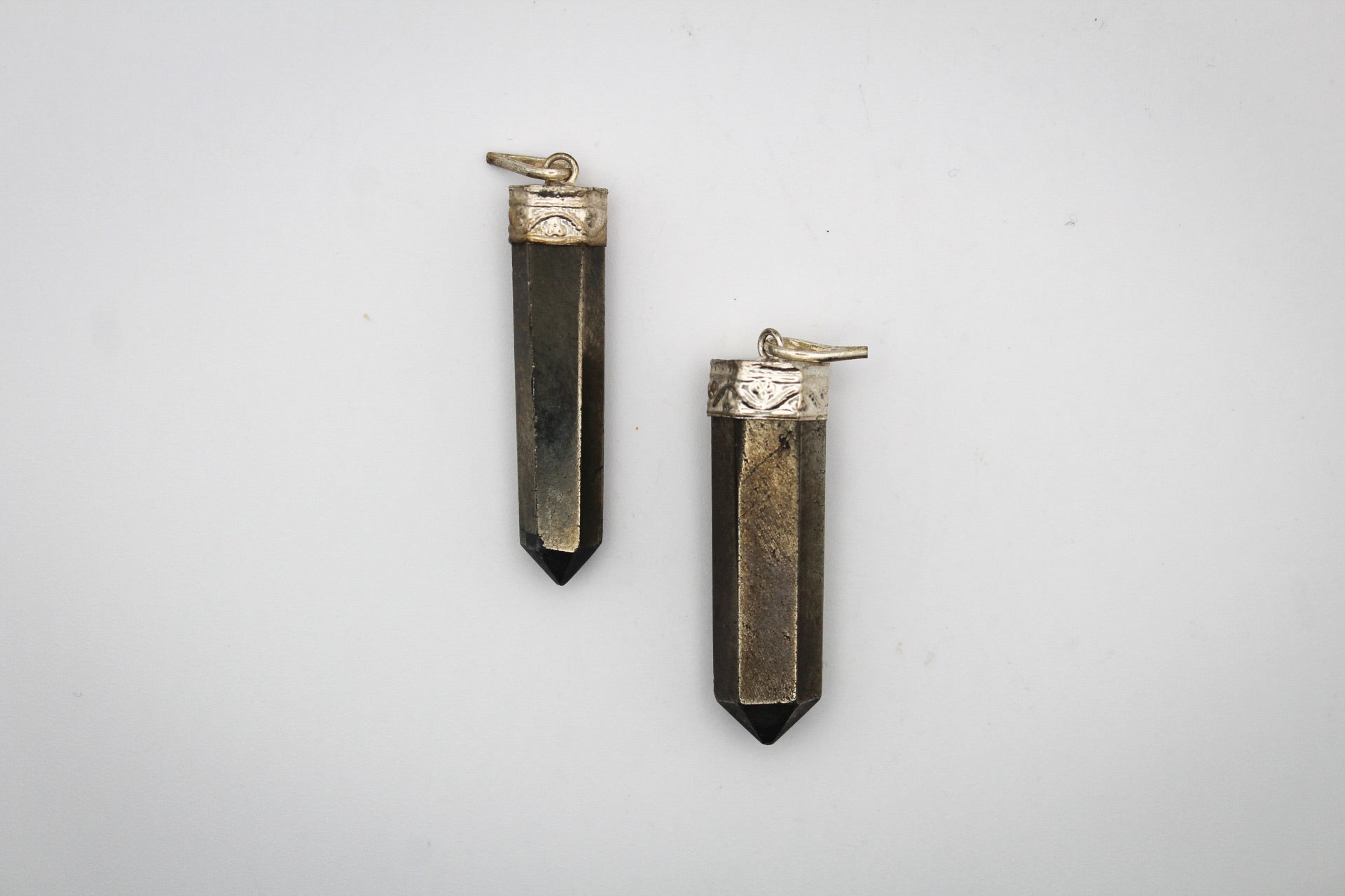 Pyrite pencil pendants.