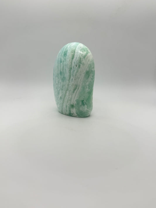 Caribbean calcite polished crystal free form in the shape of a dome.