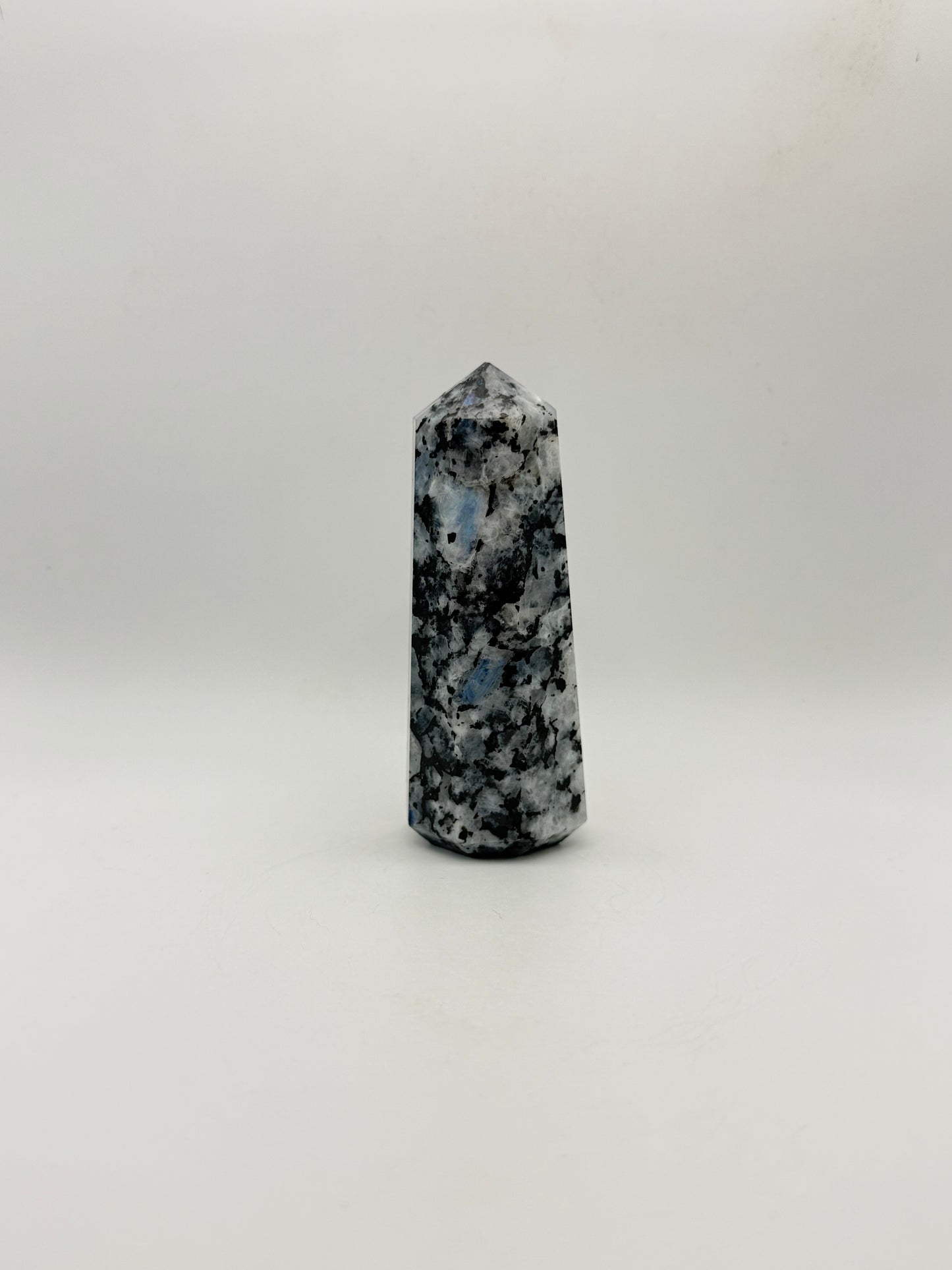 Polished rainbow moonstone tower with nice flashes of blue.