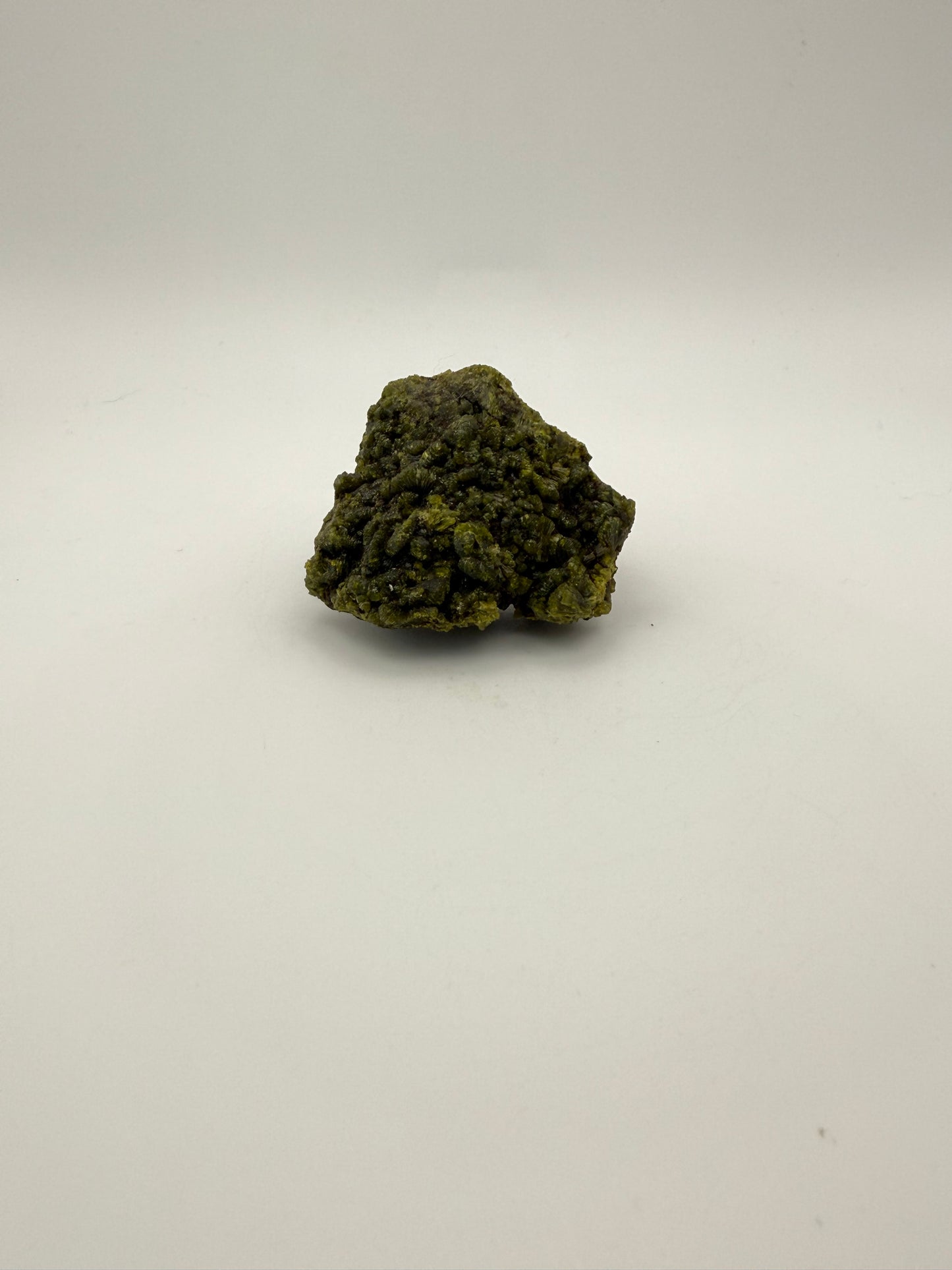 Epidote crystal cluster with good green color.