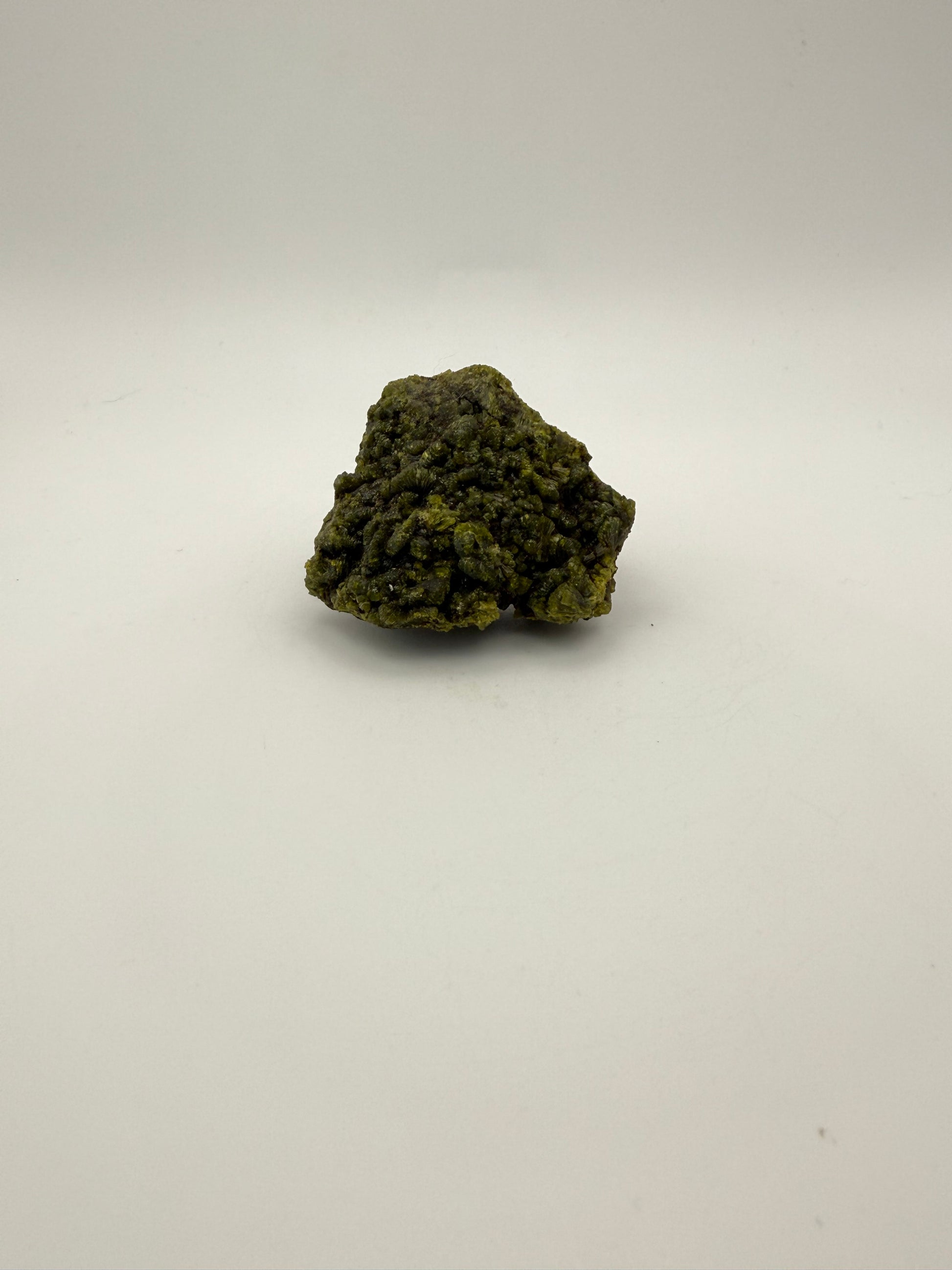 Epidote crystal cluster with good green color.
