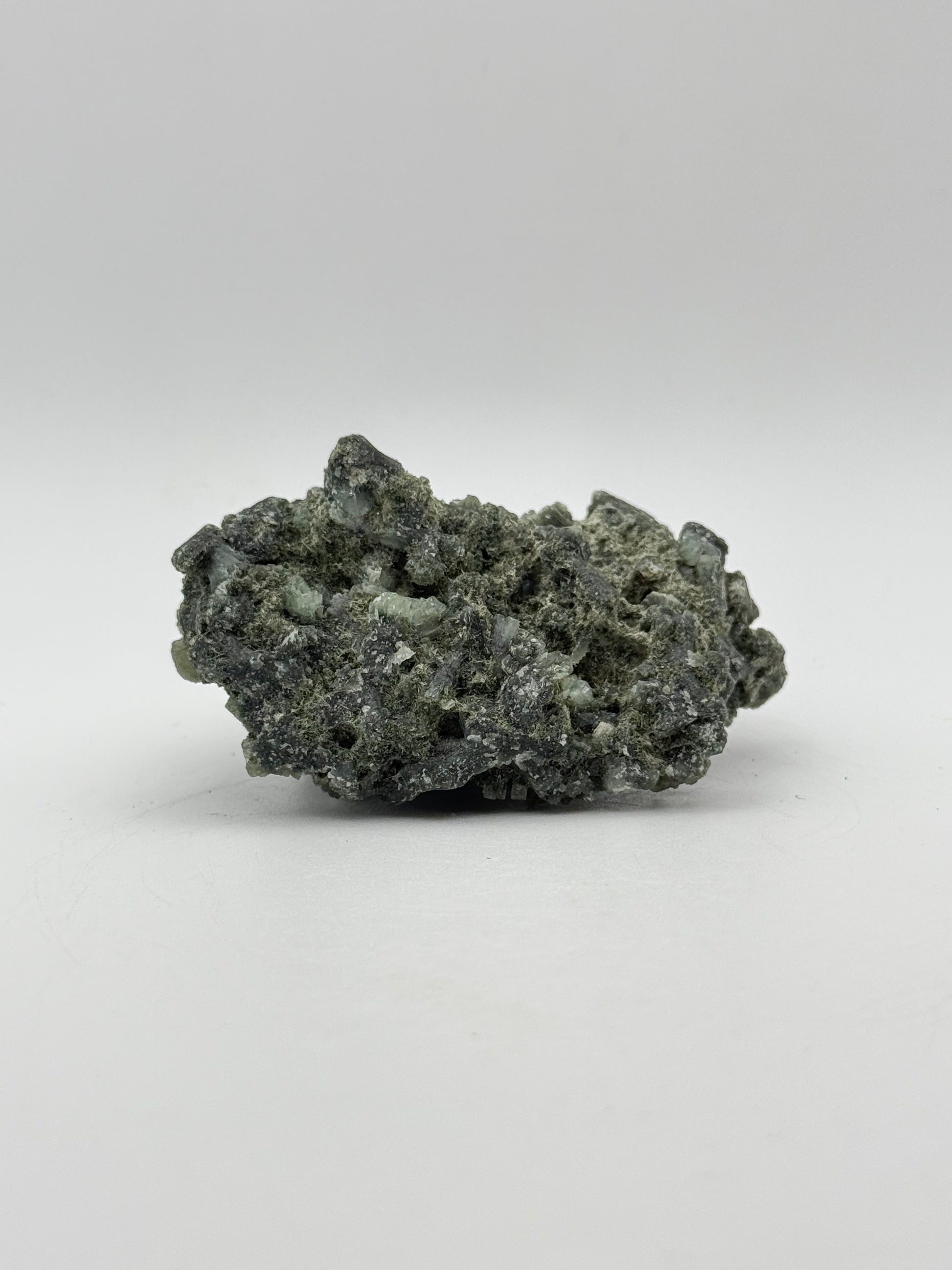 Raw prehnite specimen with amazing green color.