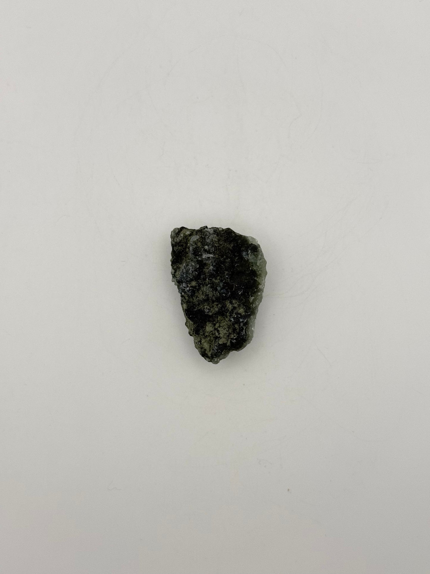 Raw Prehnite specimen with amazing green color.