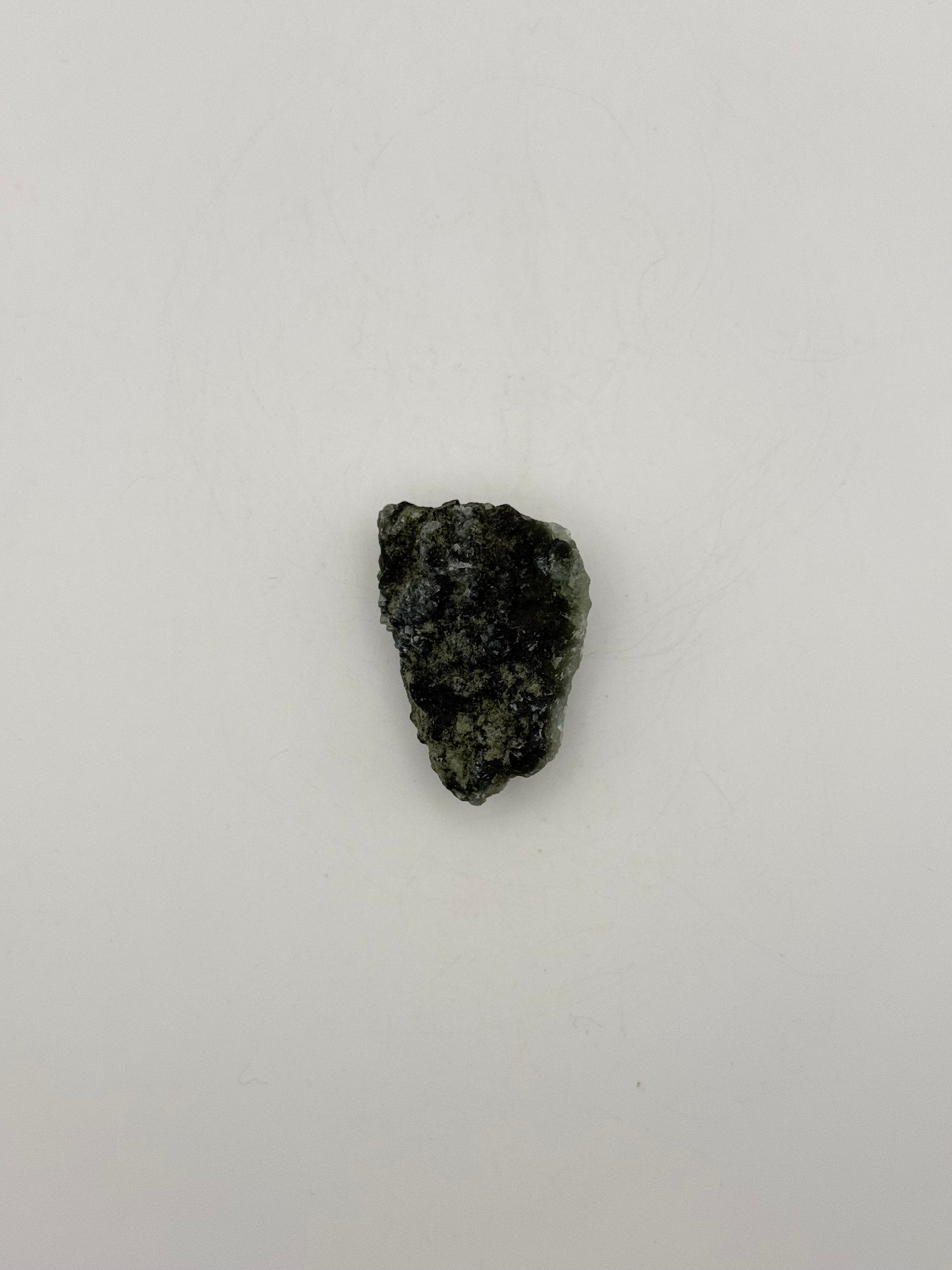 Raw Prehnite specimen with amazing green color.