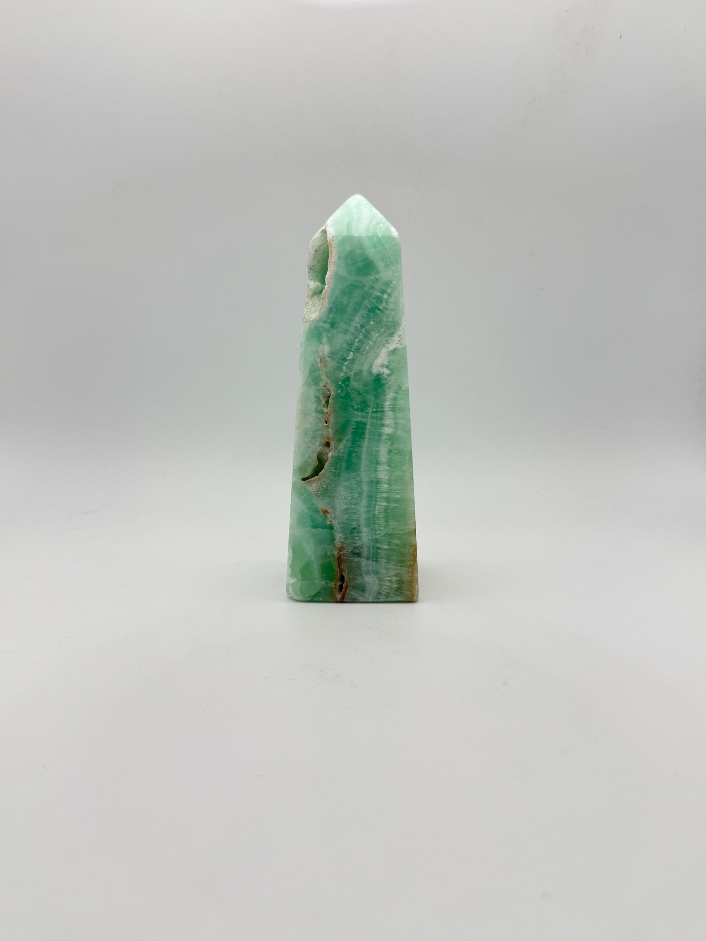 Caribbean Calcite polished four sided tower. This is 4.75 inches tall.