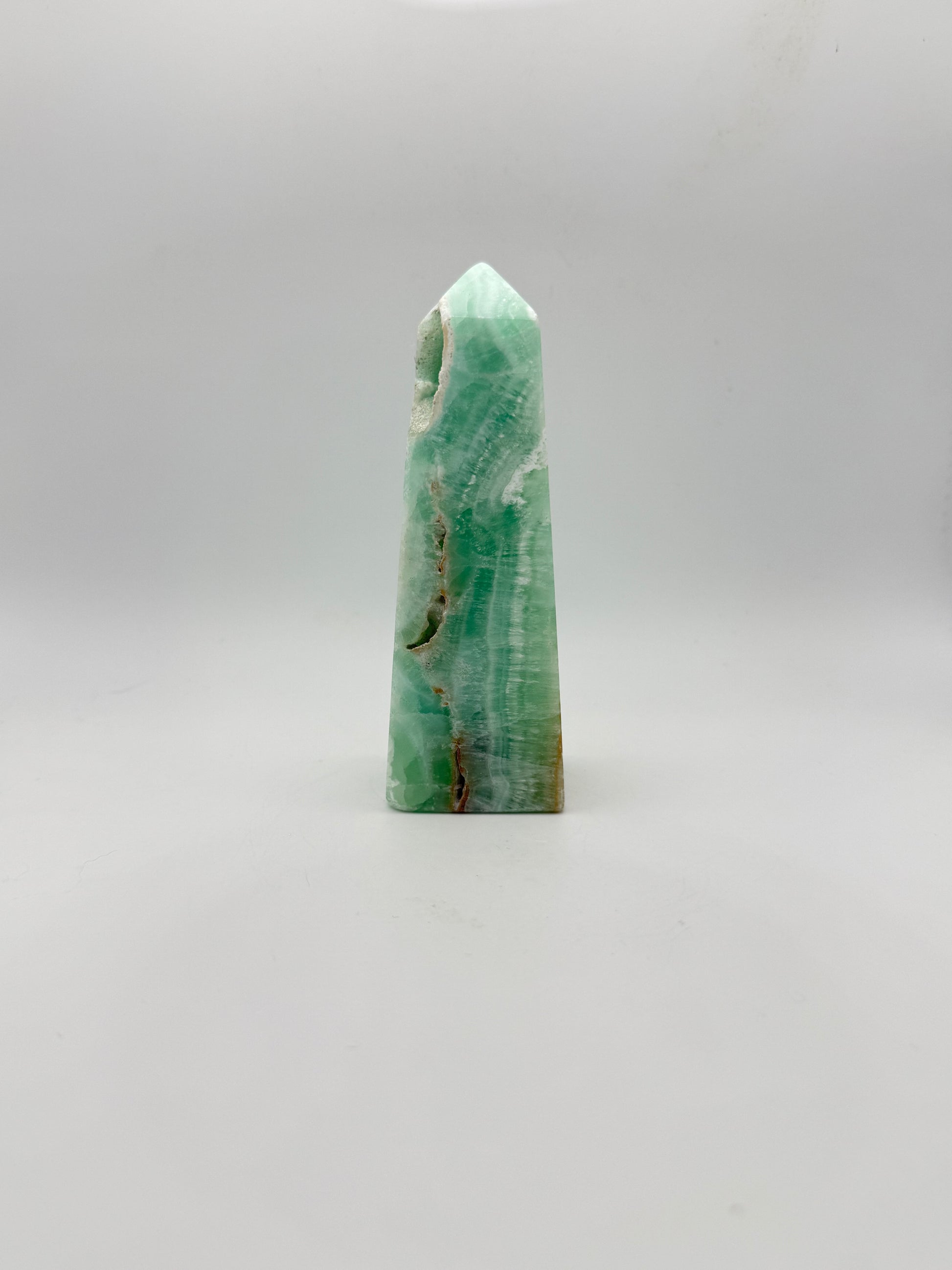 Caribbean Calcite polished four sided tower. This is 4.75 inches tall.