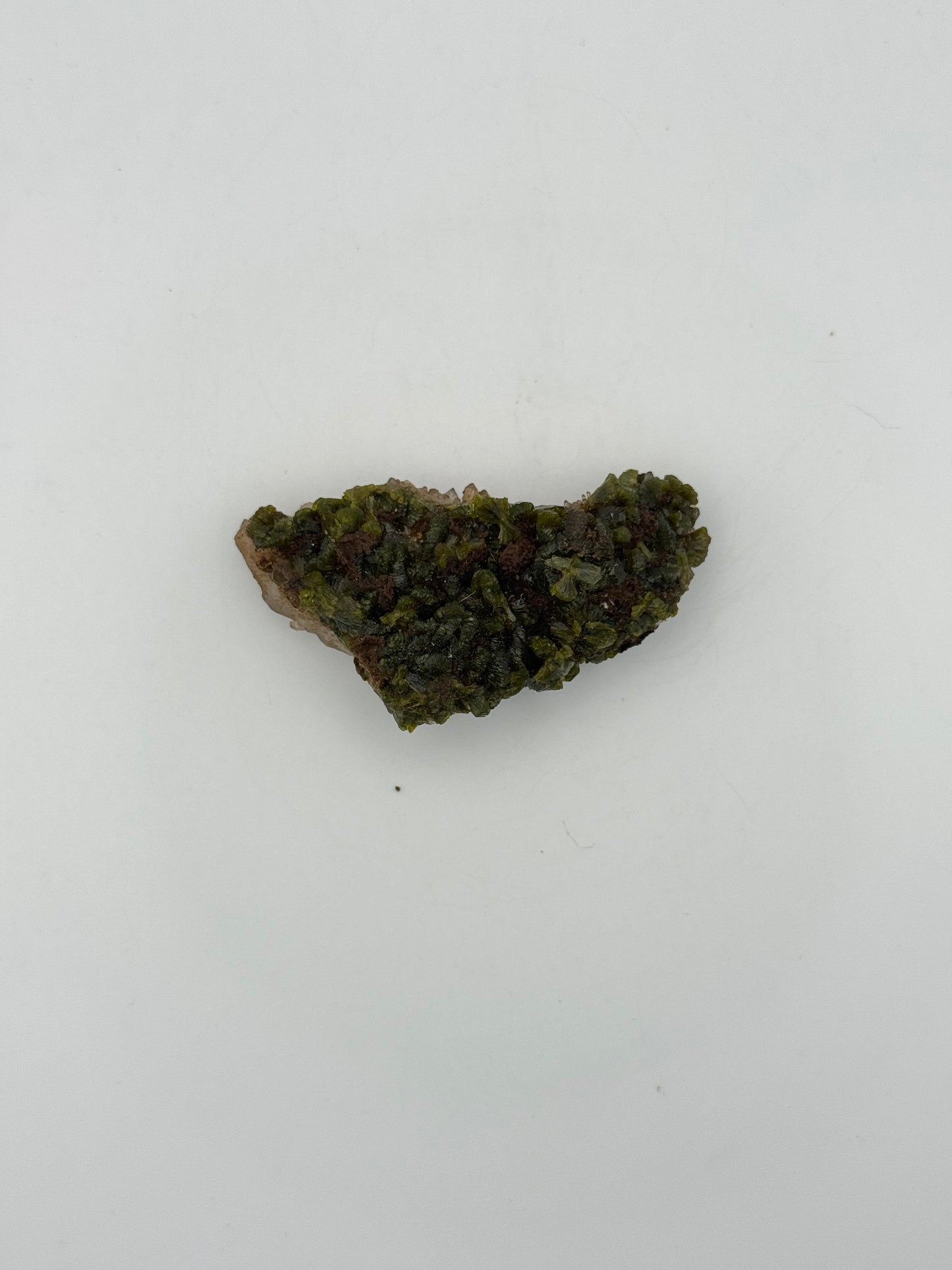 Epidote crystal cluster with good green color.