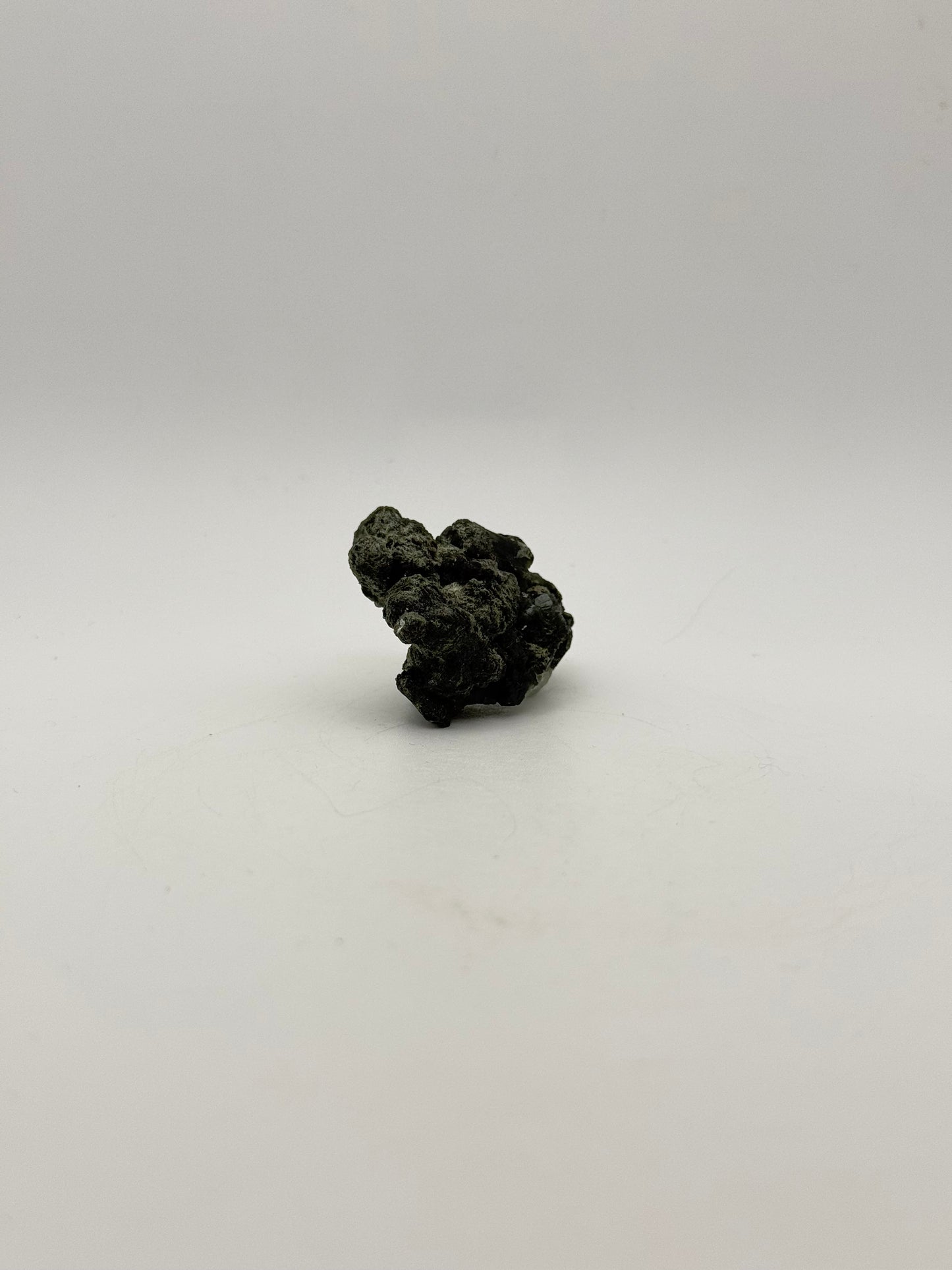 Raw prehnite specimen with amazing green color.