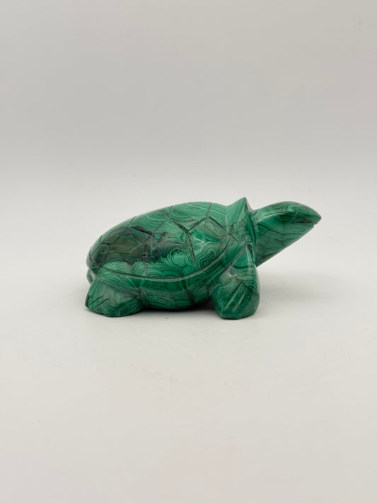 Vibrant green malachite stone carving of a turtle.