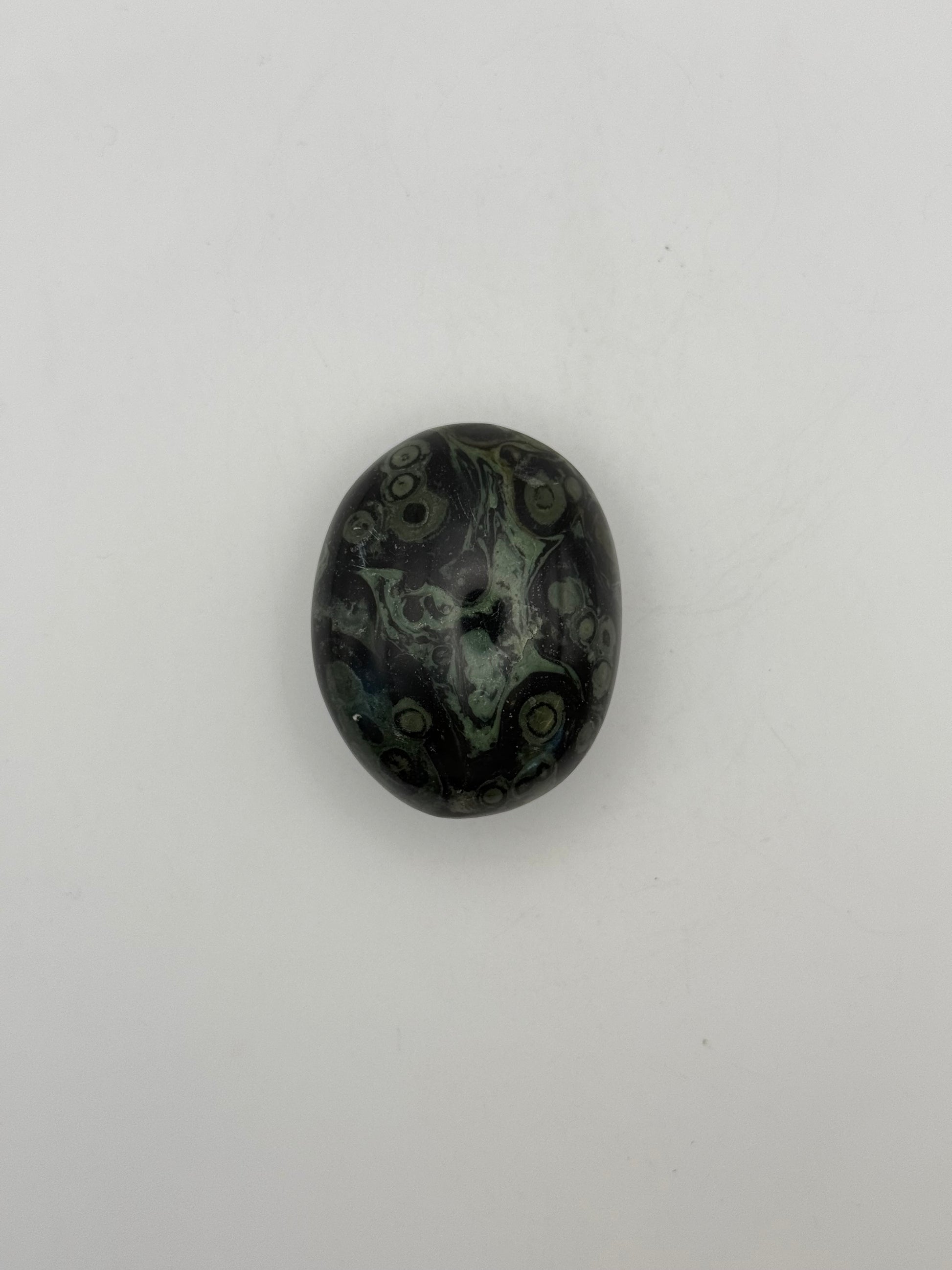 Polished kambaba jasper palm stone.