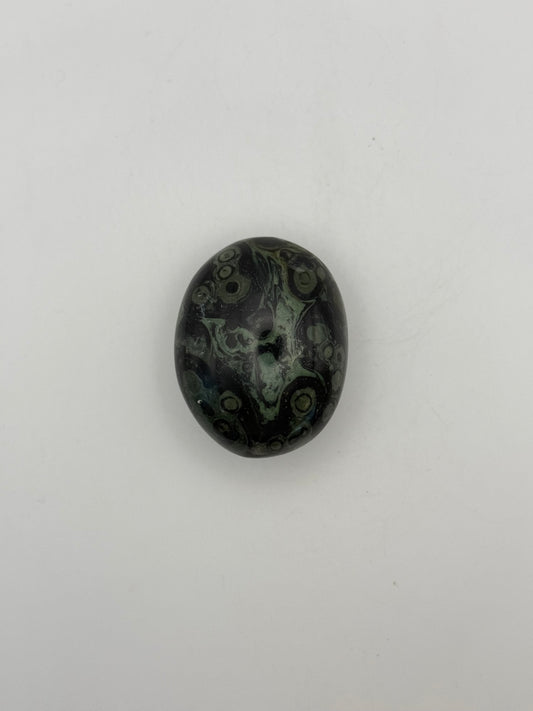 Polished kambaba jasper palm stone.