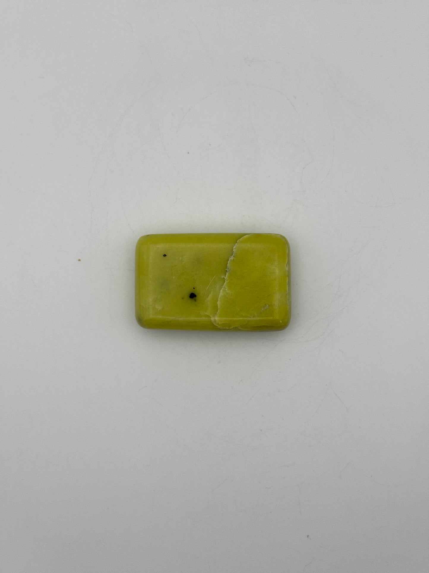 Polished healerite in the shape of a rectangular soap.
