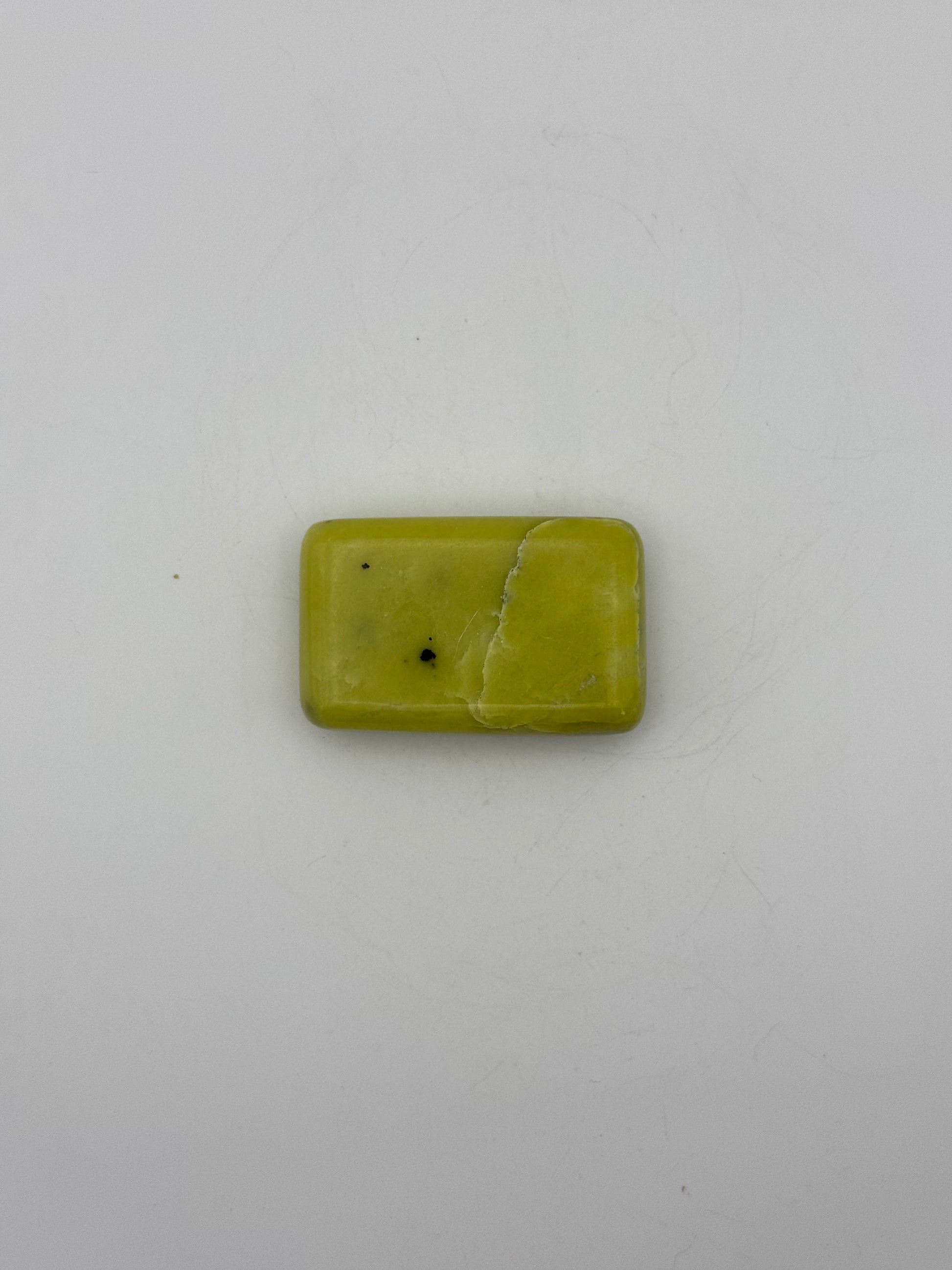 Polished healerite in the shape of a rectangular soap.