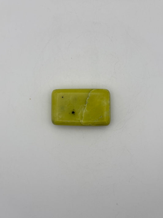Polished healerite in the shape of a rectangular soap.