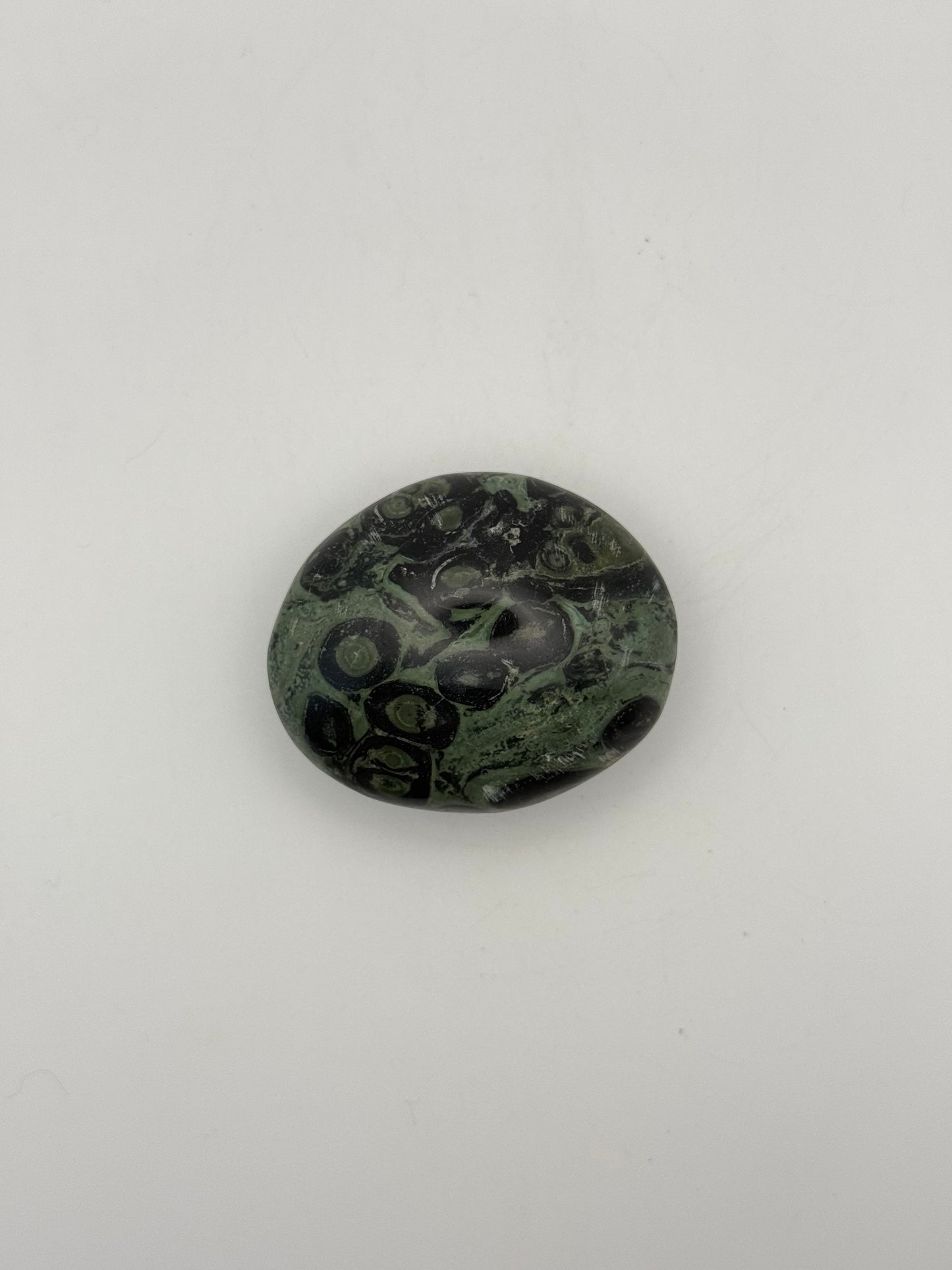 Polished kambaba jasper palm stone.
