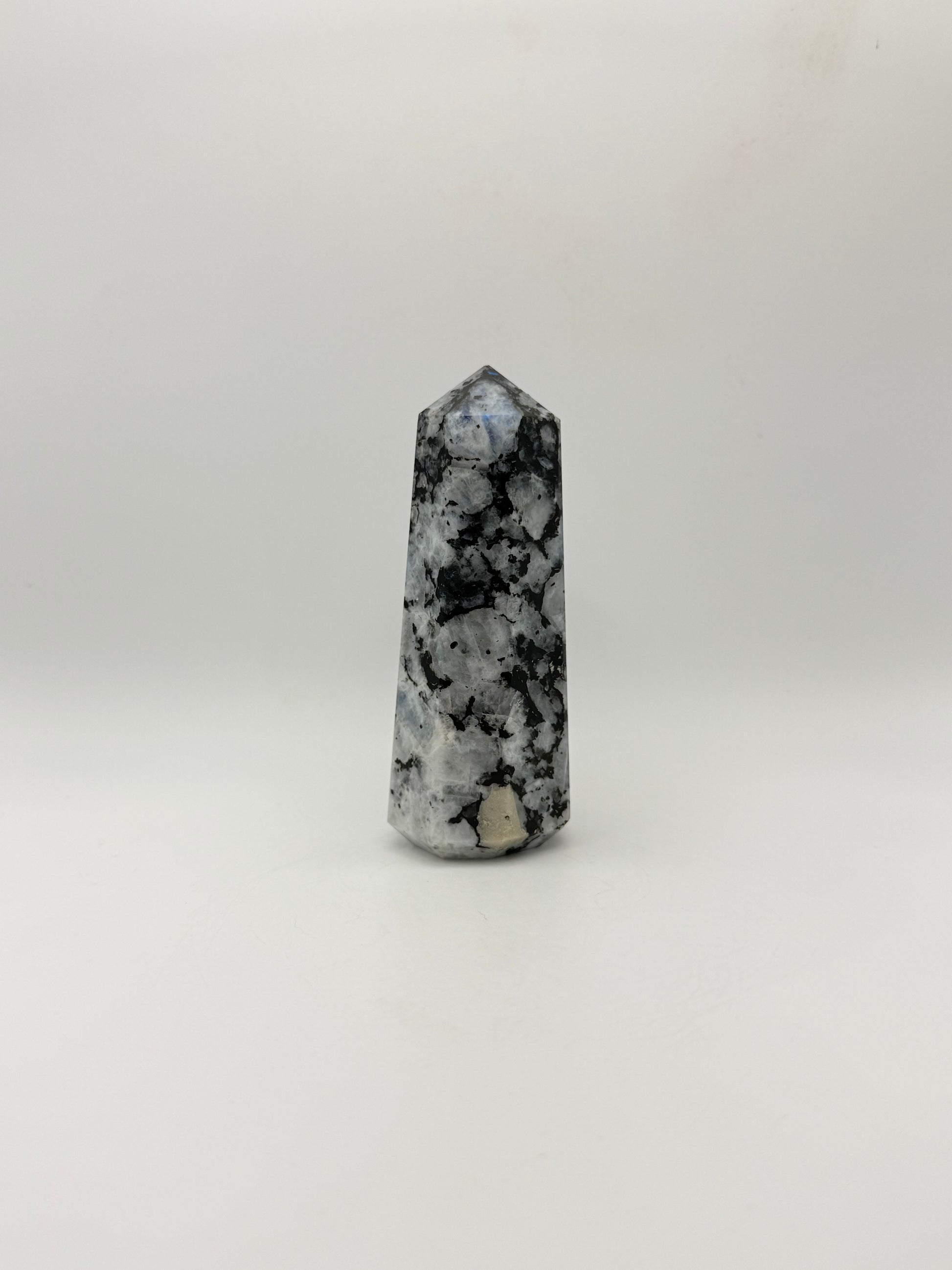 Polished rainbow moonstone tower with nice flashes of blue.