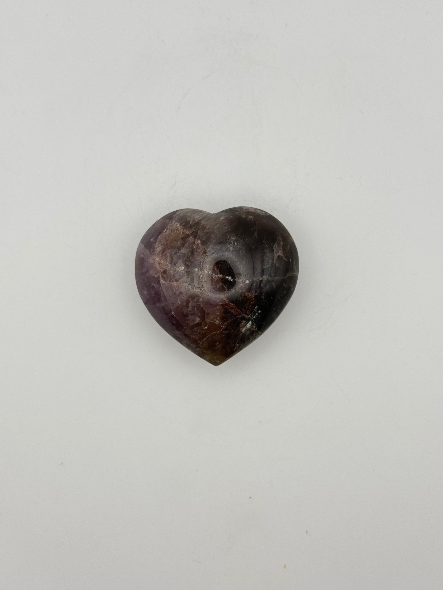 Polished super 7 in the shape of a heart.